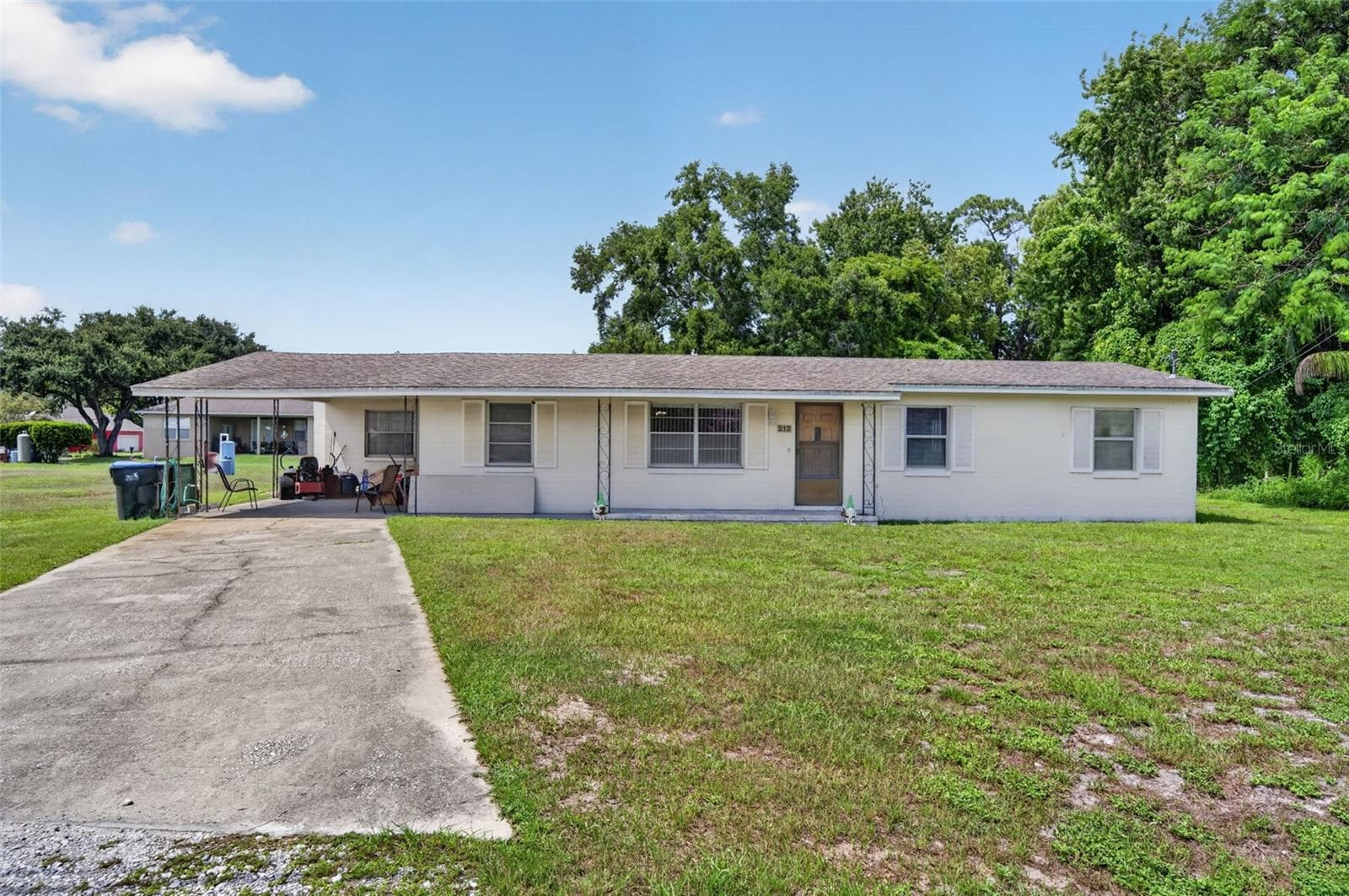 Front exterior, daytime — a sound, income-capable structure on the parcel. - 212 15TH AVE, OCOEE