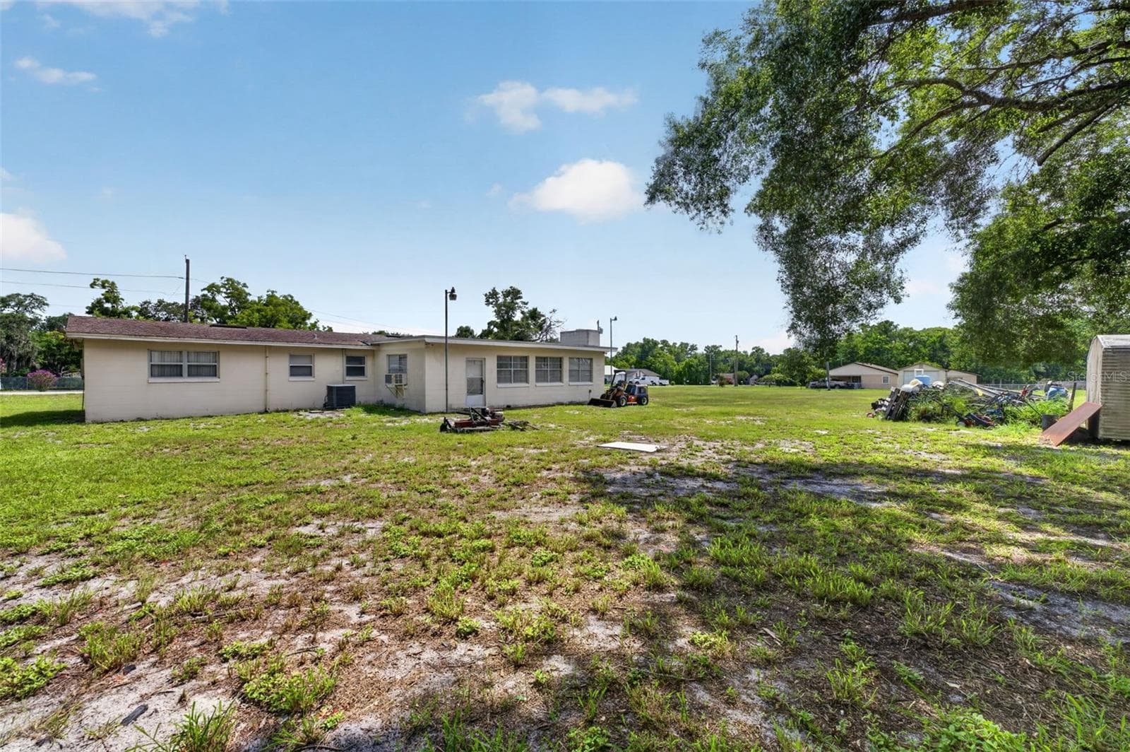 Open rear/side yard — cleared area available for subdivision. - 212 15TH AVE, OCOEE