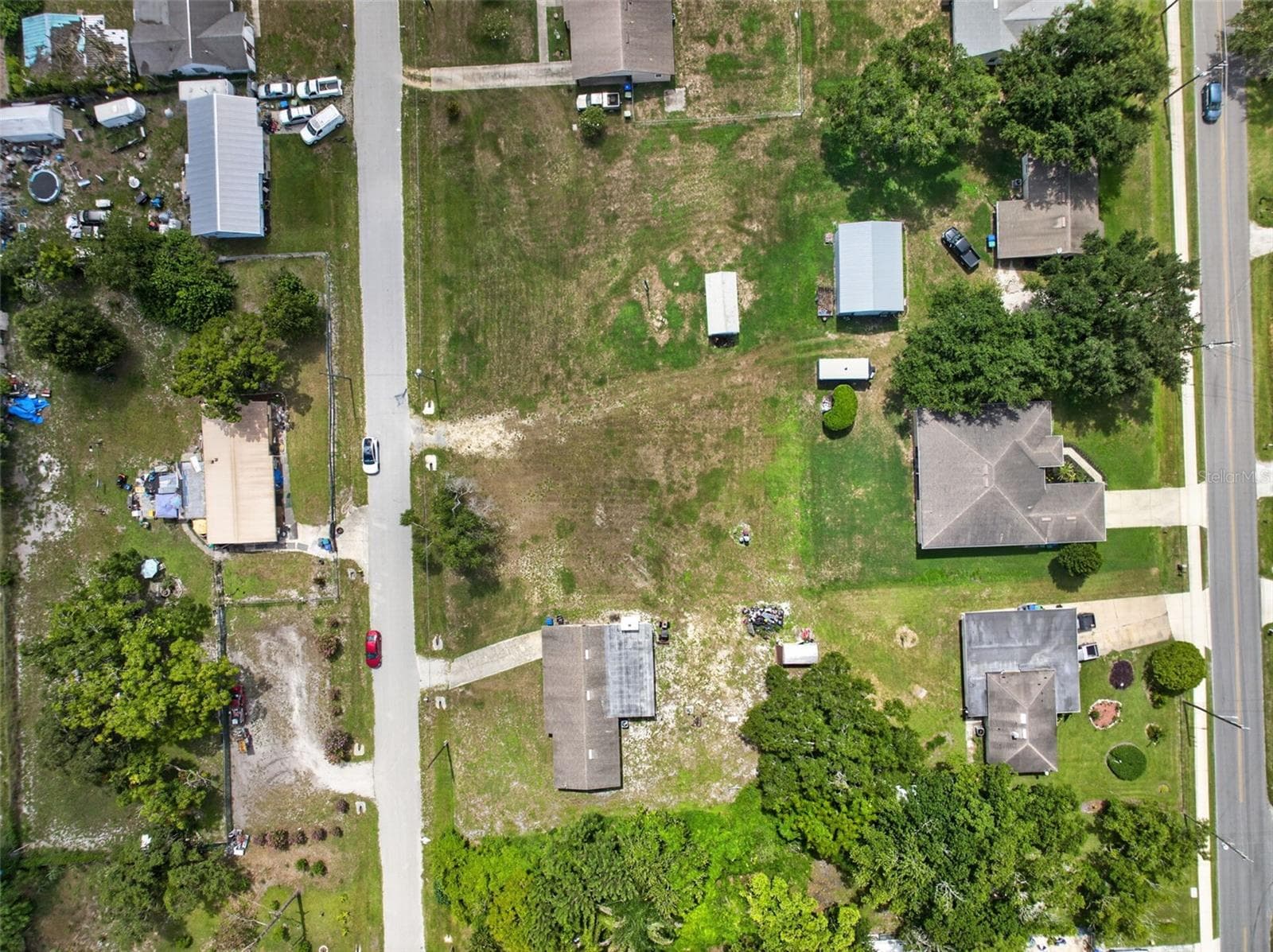 Overhead view showing the home, shed, and surrounding yard. - 212 15TH AVE, OCOEE