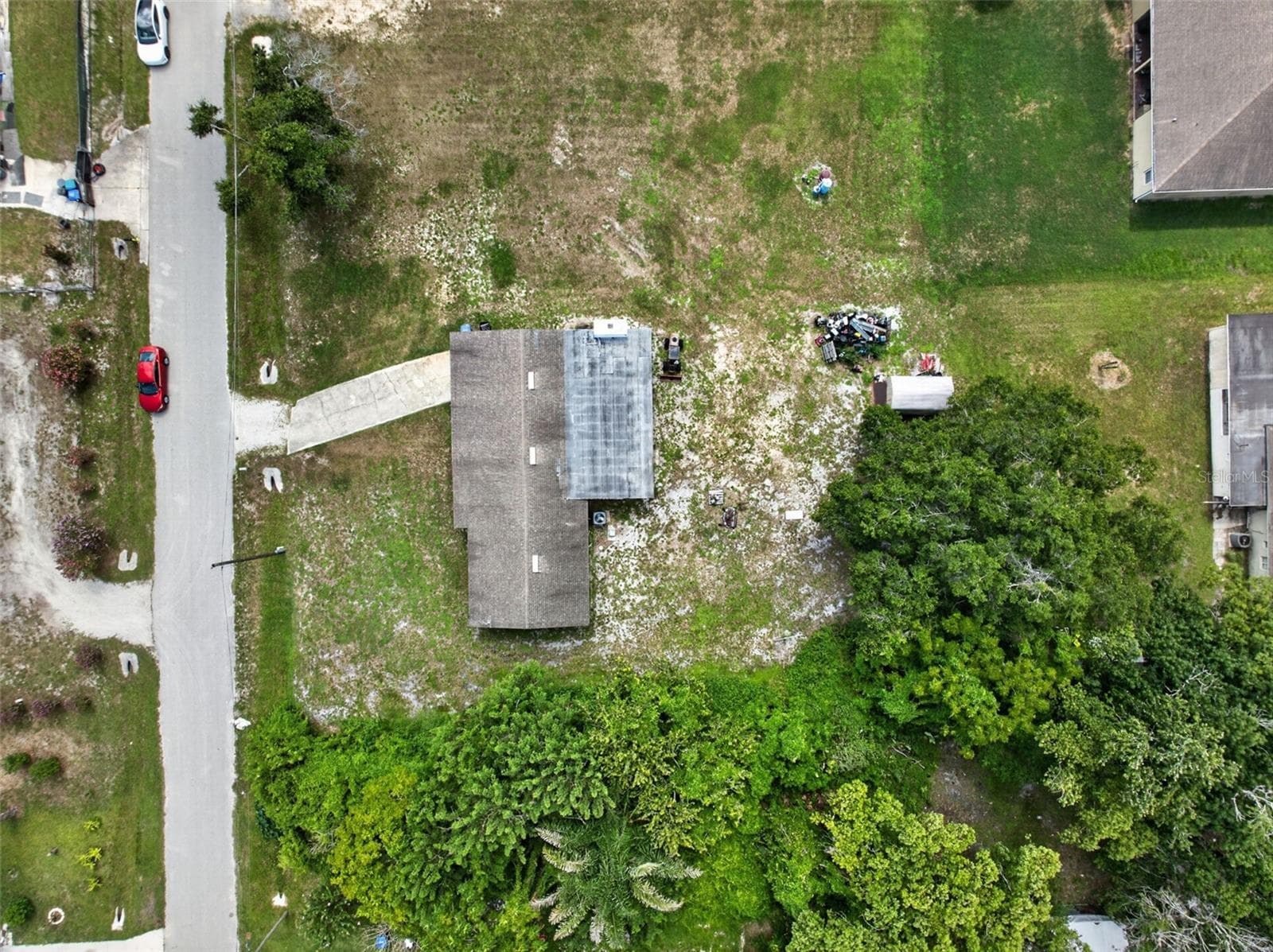 Close aerial view of the property and adjacent street. - 212 15TH AVE, OCOEE