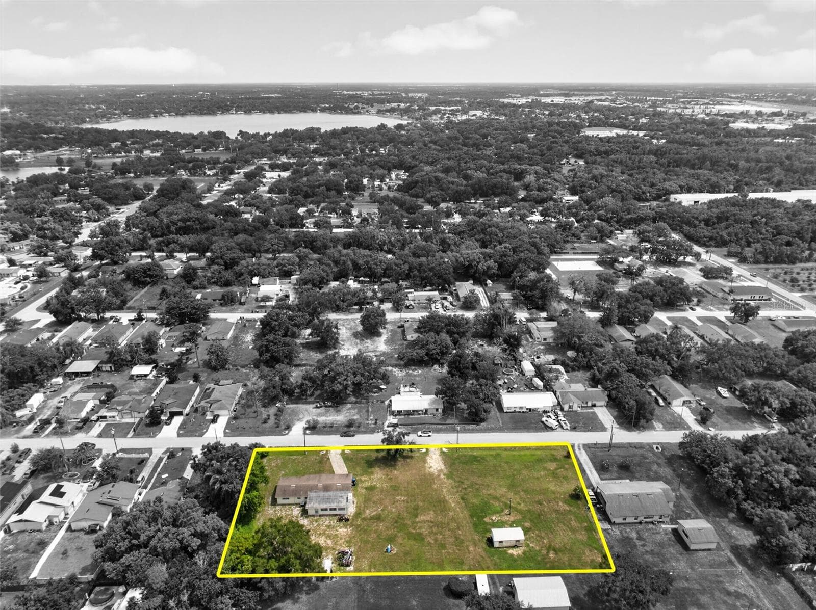 Aerial spotlight highlighting the property within the block. - 212 15TH AVE, OCOEE