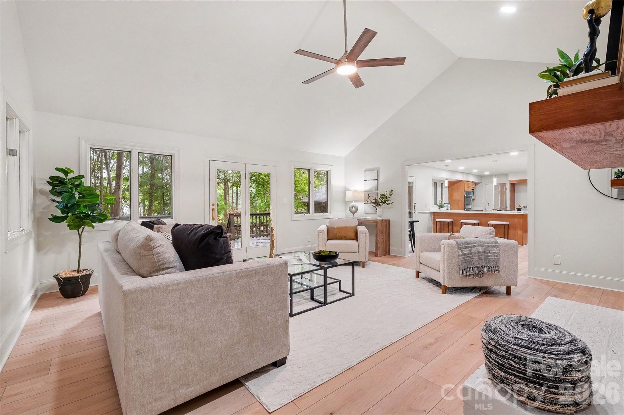 Entertaining a breeze here as the great room opens to the kitchen in one direction and to a large deck in another. - 5042 Marci Lane, Belmont