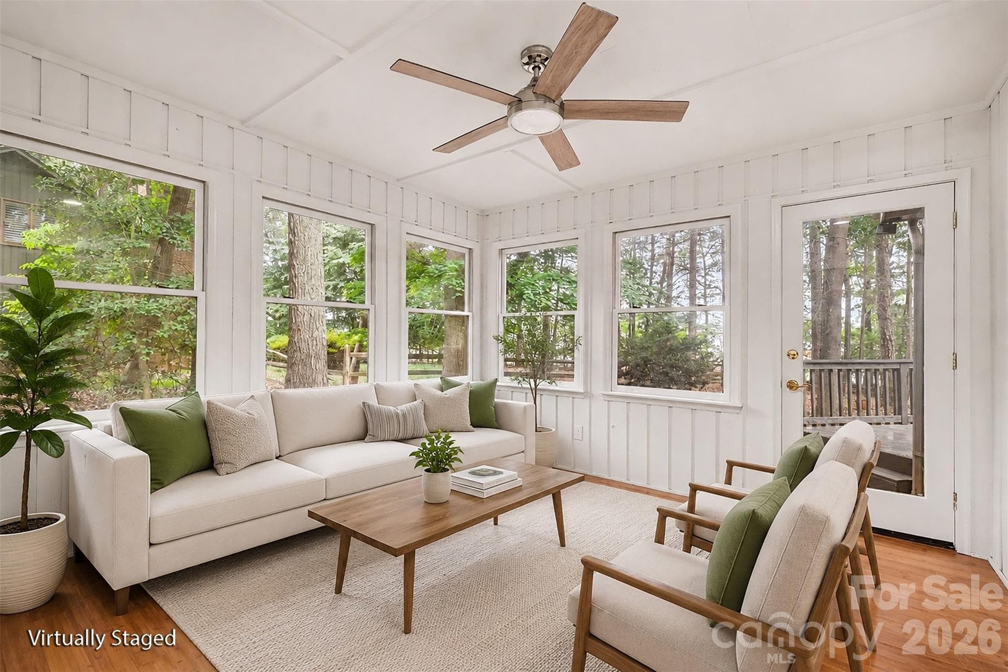 Your new sun room is just off the owners' bedroom and the great room, a wonderful retreat for morning coffee or ready a book on a rainy day. (Yes, it also has heating and cooling.) - 5042 Marci Lane, Belmont