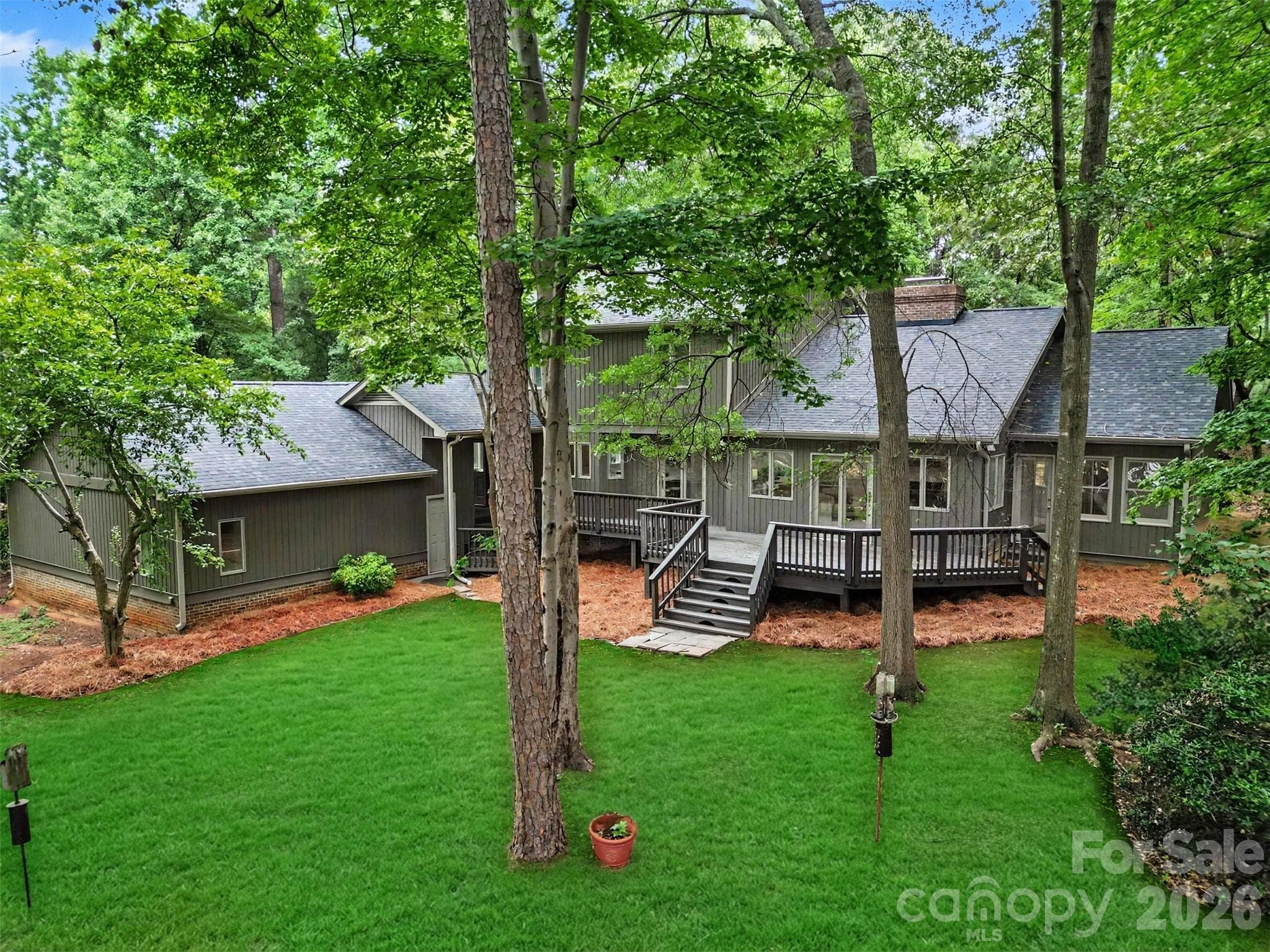 Your 0.82-acre lot is full of gorgeous mature trees. - 5042 Marci Lane, Belmont