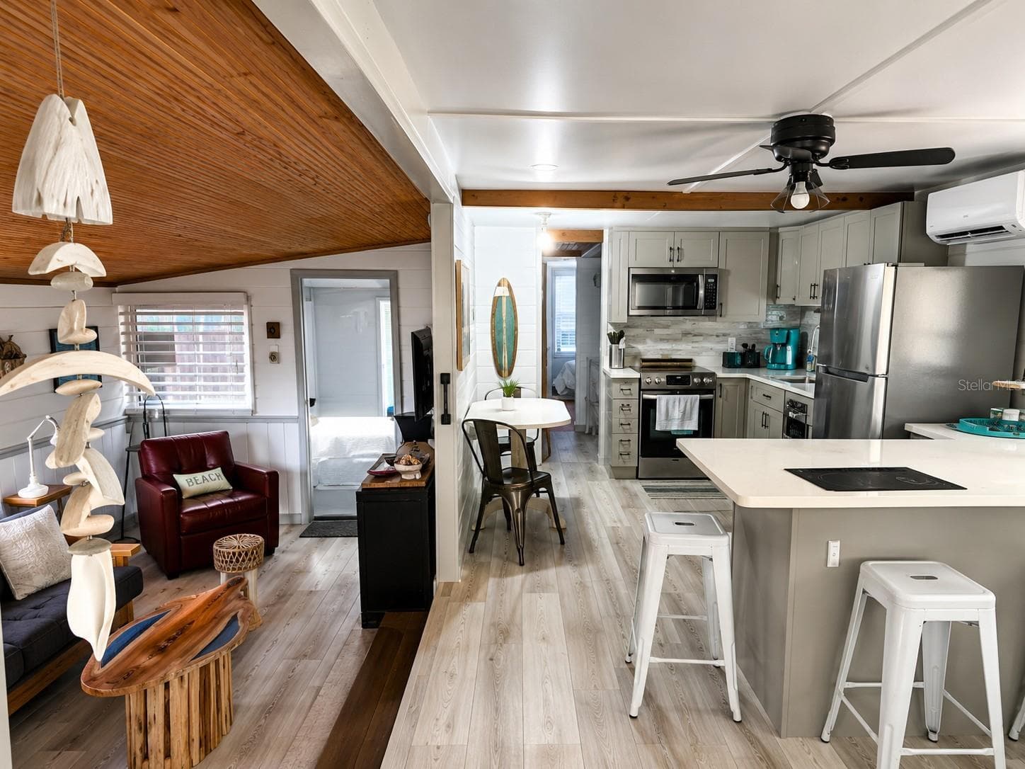 split Photo, LR on left, Kitchen on Right. Open Floorplan - 3717 115TH STREET CT W, BRADENTON
