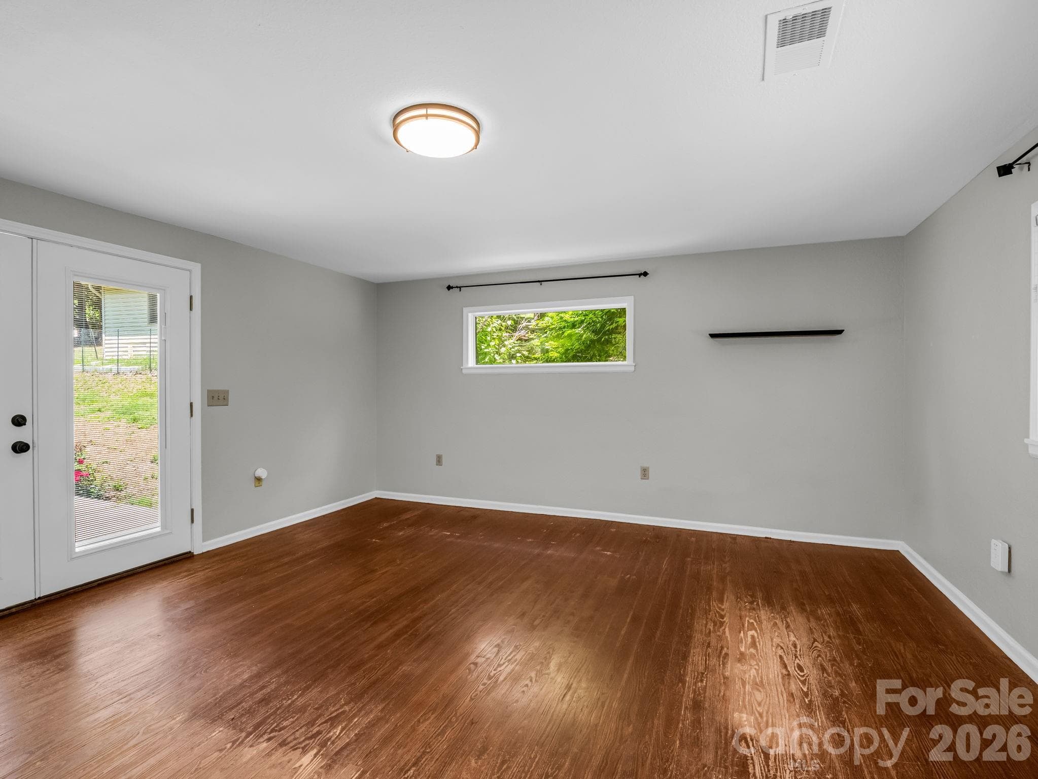 Family Room off of Living Room, doors open to back patio - 35 Chastain Hill Road, Mills River