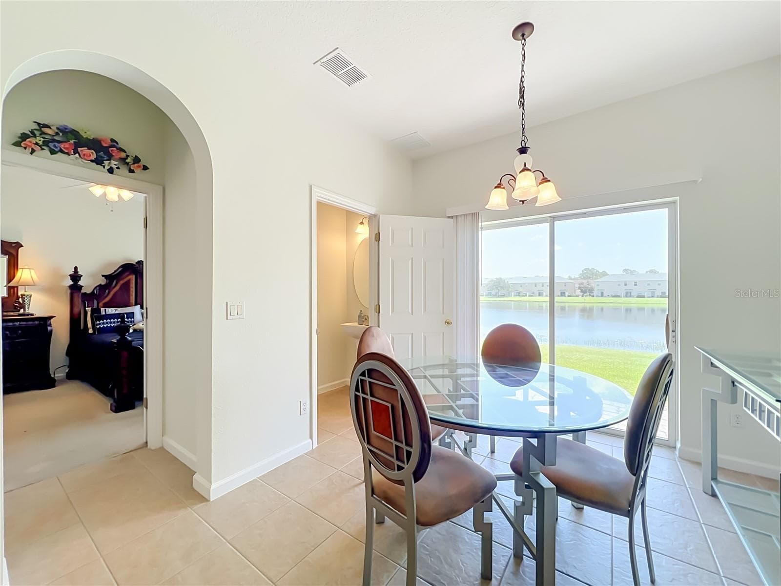 Dinette area and 1/2 bath with gorgeous water view. - 16543 CEDAR CREST DR, ORLANDO