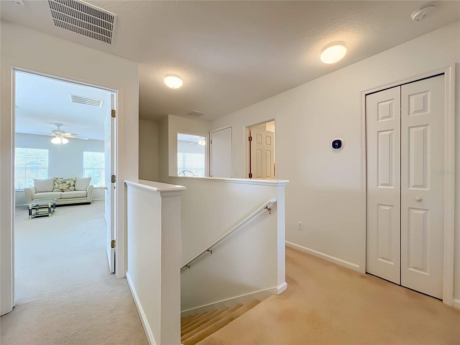 Second floor landing with 2 rooms on the left and right view with full bath. - 16543 CEDAR CREST DR, ORLANDO