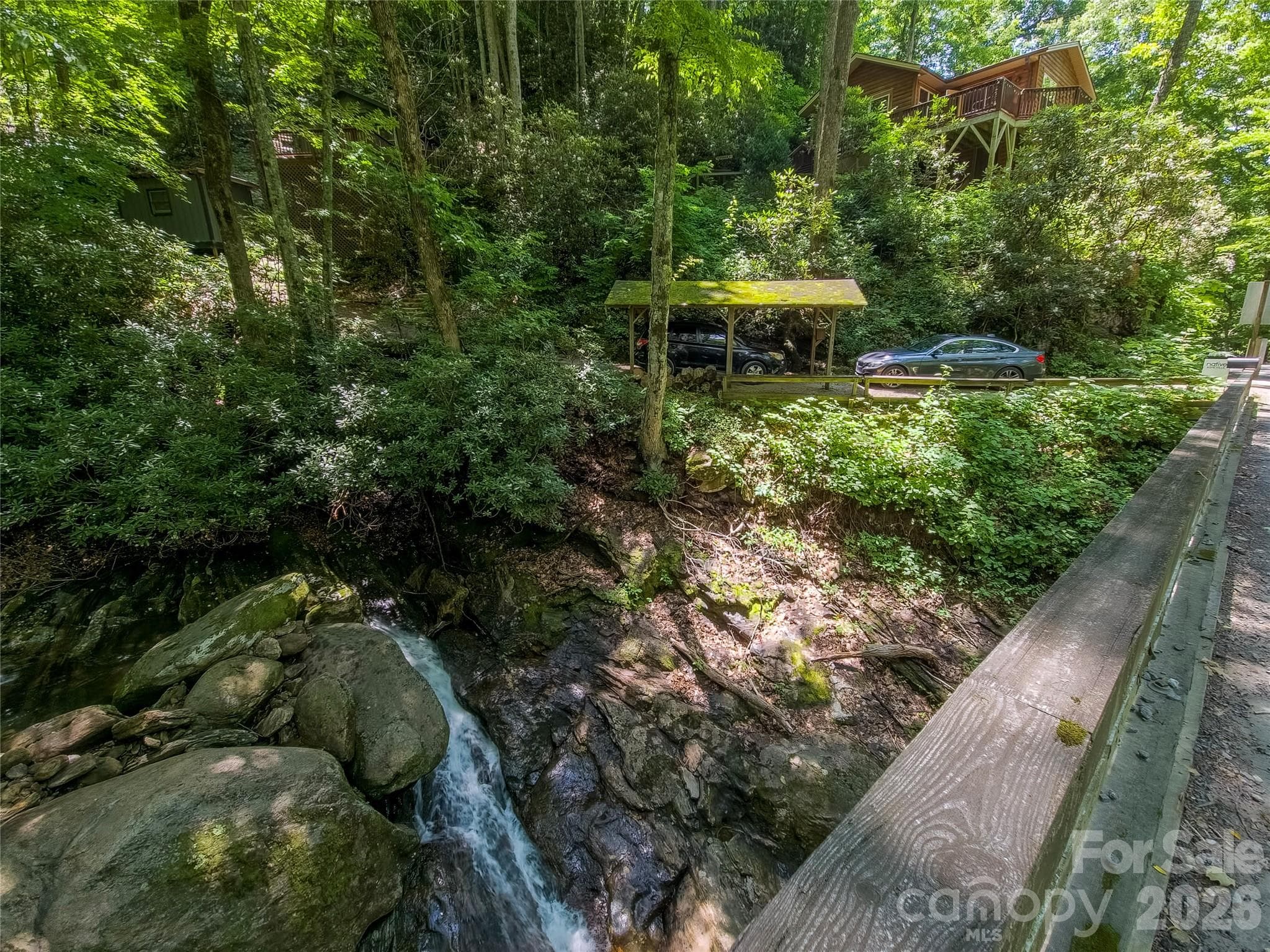 Rushing creek borders property - 500 Winter Star Road, Burnsville