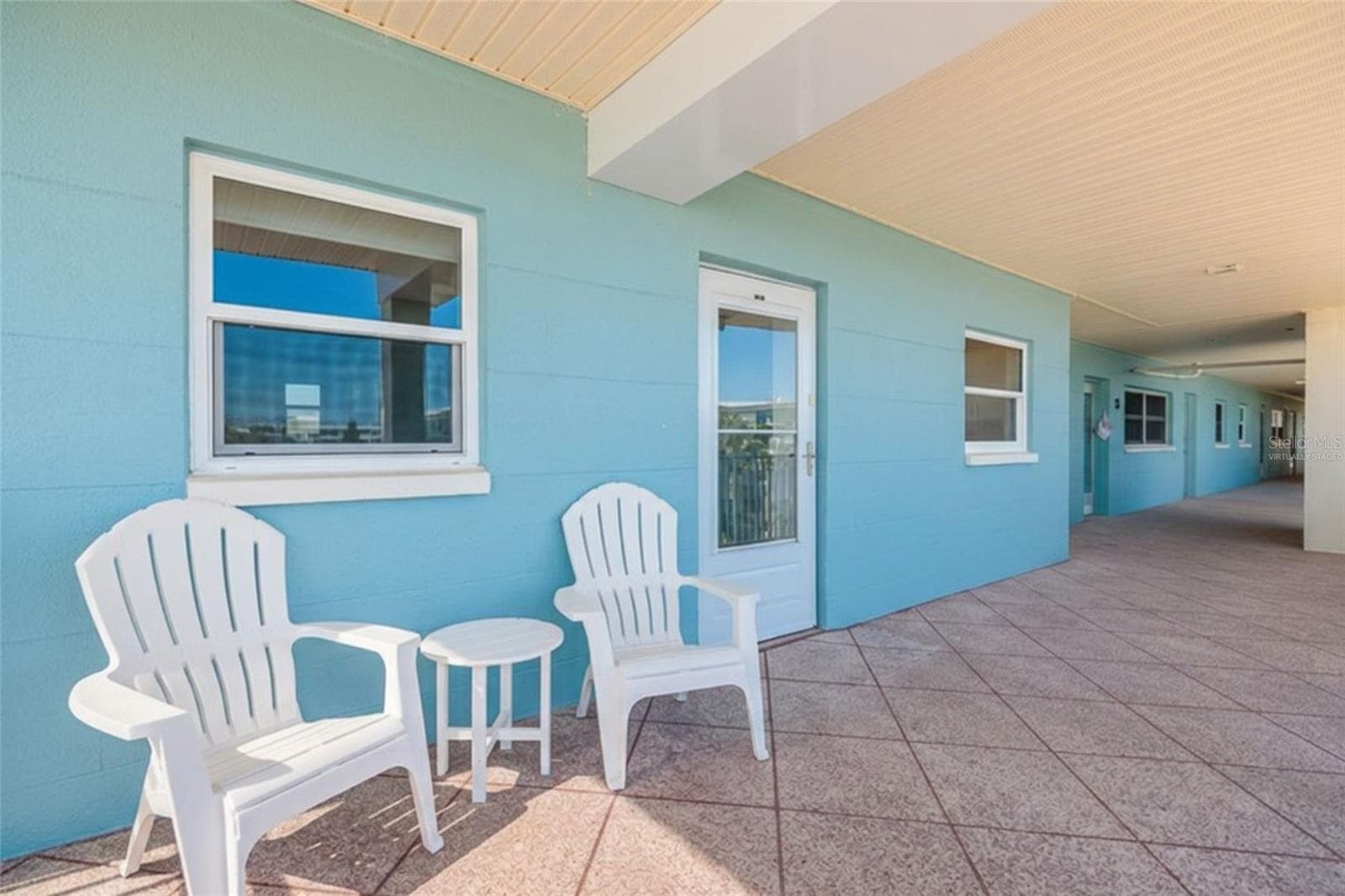 Virtually Staged. Relax on your covered front walkway/porch, enjoy the ocean breeze & sunsets. - 6061 2ND ST E #55, ST PETE BEACH