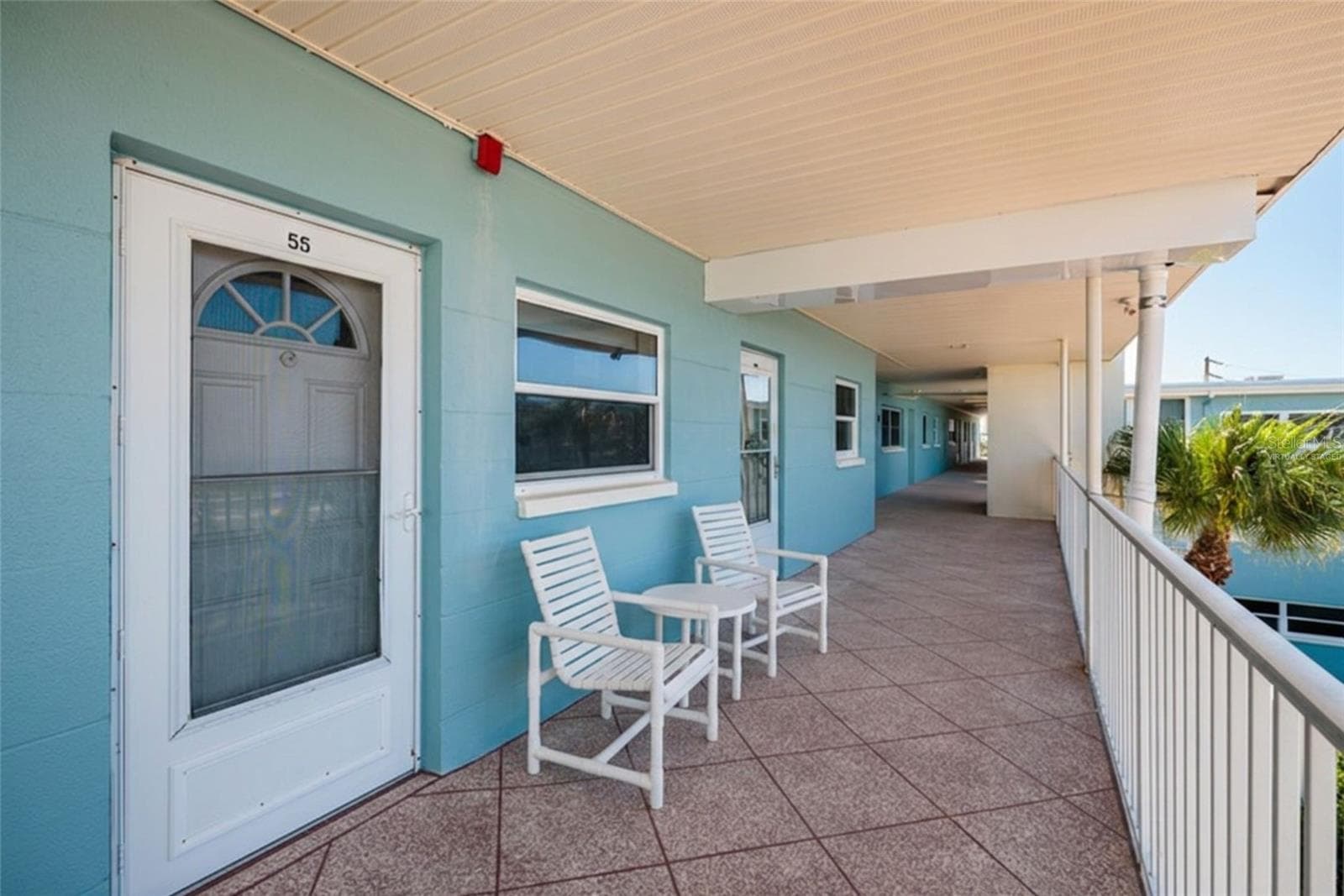 Virtually Staged. Door to 2nd bedroom on left & front door on right. Elevator in front of next unit down walkway. - 6061 2ND ST E #55, ST PETE BEACH