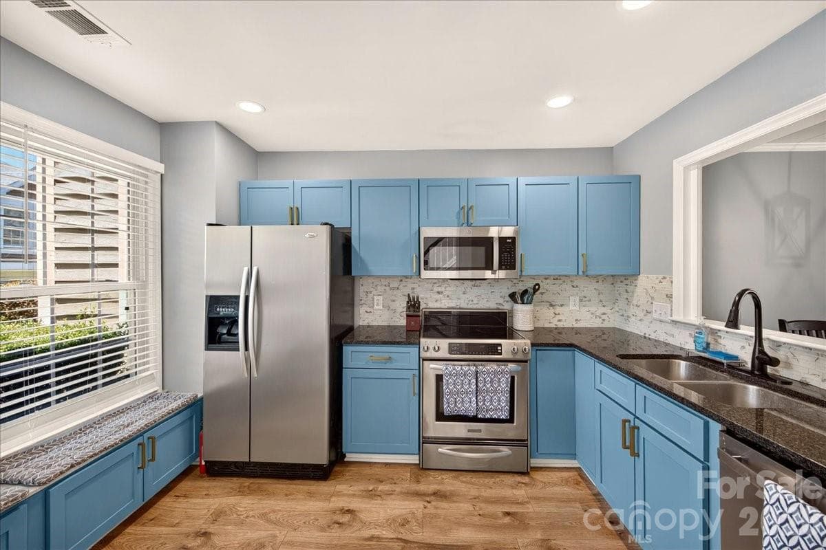 Kitchen with granite countertops, stainless appliances - 8220 Legare Court, Charlotte