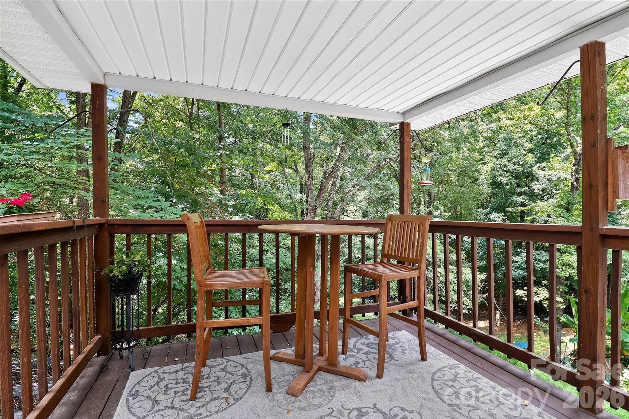 Enjoy your morning beverage on this covered deck in the trees! - 7912 Ritter Drive, Charlotte