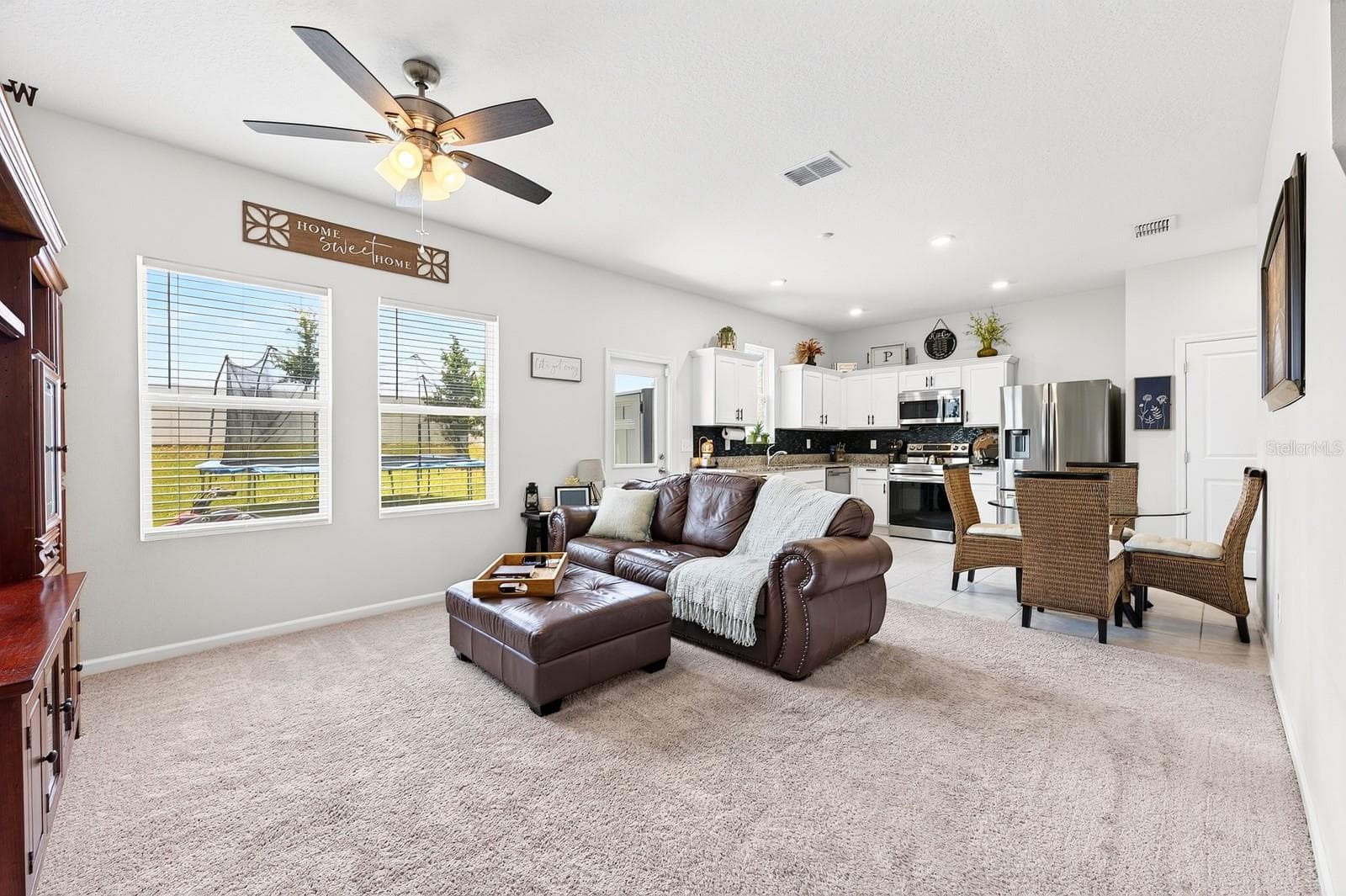 Inside, the thoughtfully designed OPEN-CONCEPT FLOOR PLAN seamlessly connects the Living Room and Kitchen, making it ideal for both everyday living and entertaining. - 1961 HEMINGWAY CIR, GROVELAND