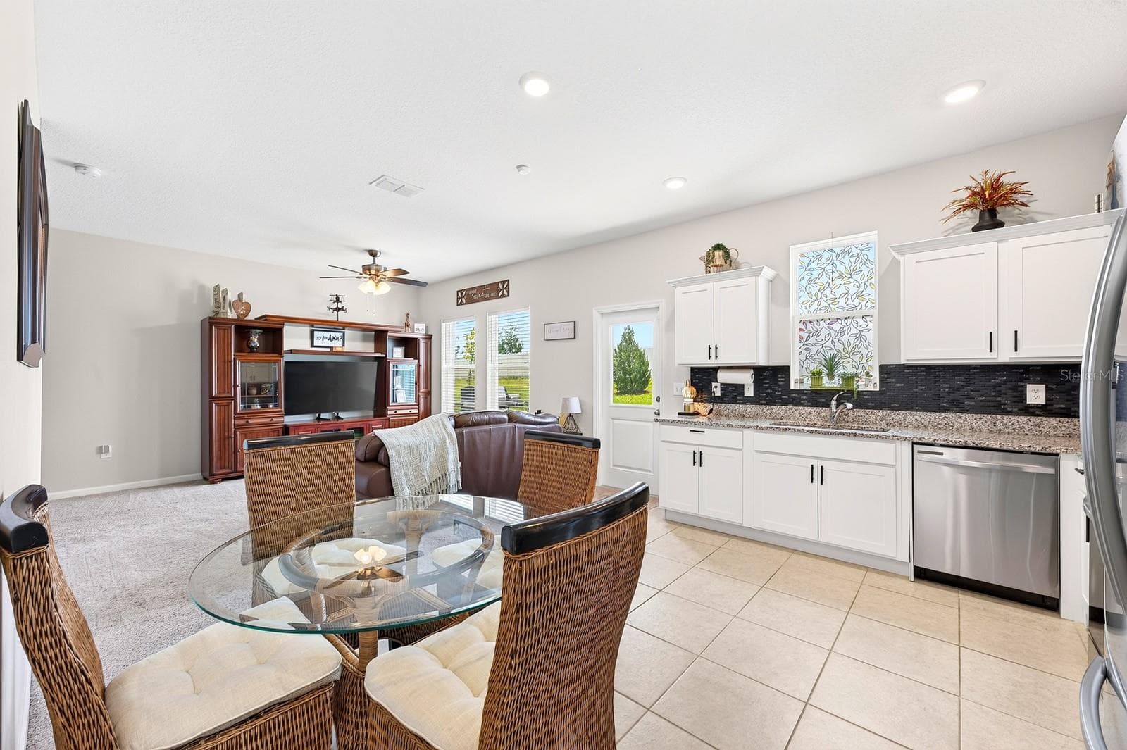 A SPACIOUS EAT-IN DINING AREA is perfect for casual family meals or gathering with friends. - 1961 HEMINGWAY CIR, GROVELAND