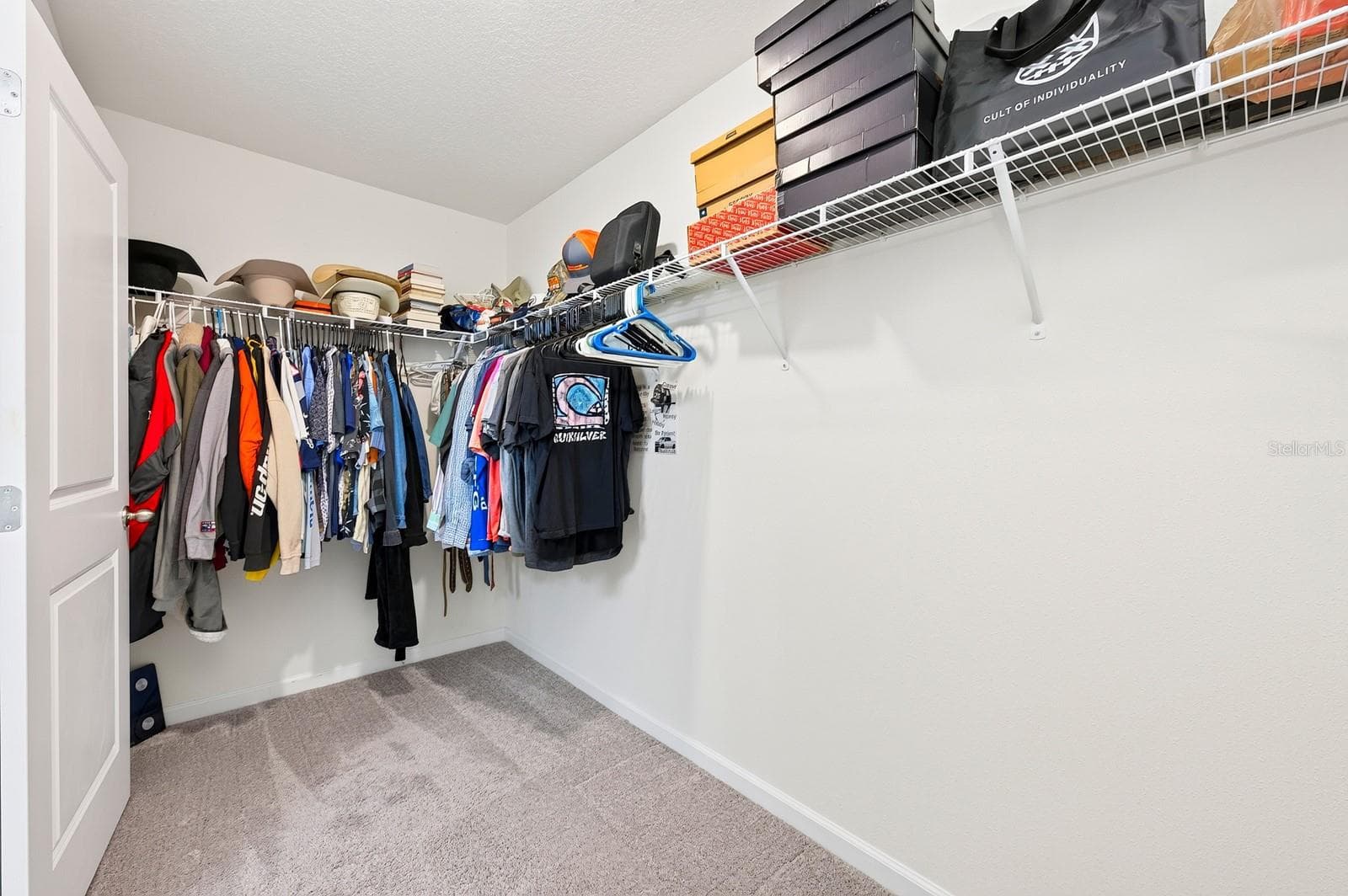 The Primary suite boasts a generous walk-in closet. - 1961 HEMINGWAY CIR, GROVELAND