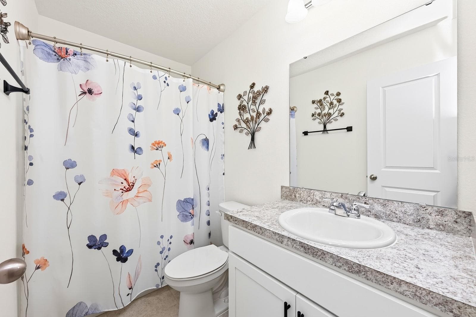 Two additional bedrooms, each with their own WALK-IN CLOSETS, share a full Bathroom. - 1961 HEMINGWAY CIR, GROVELAND