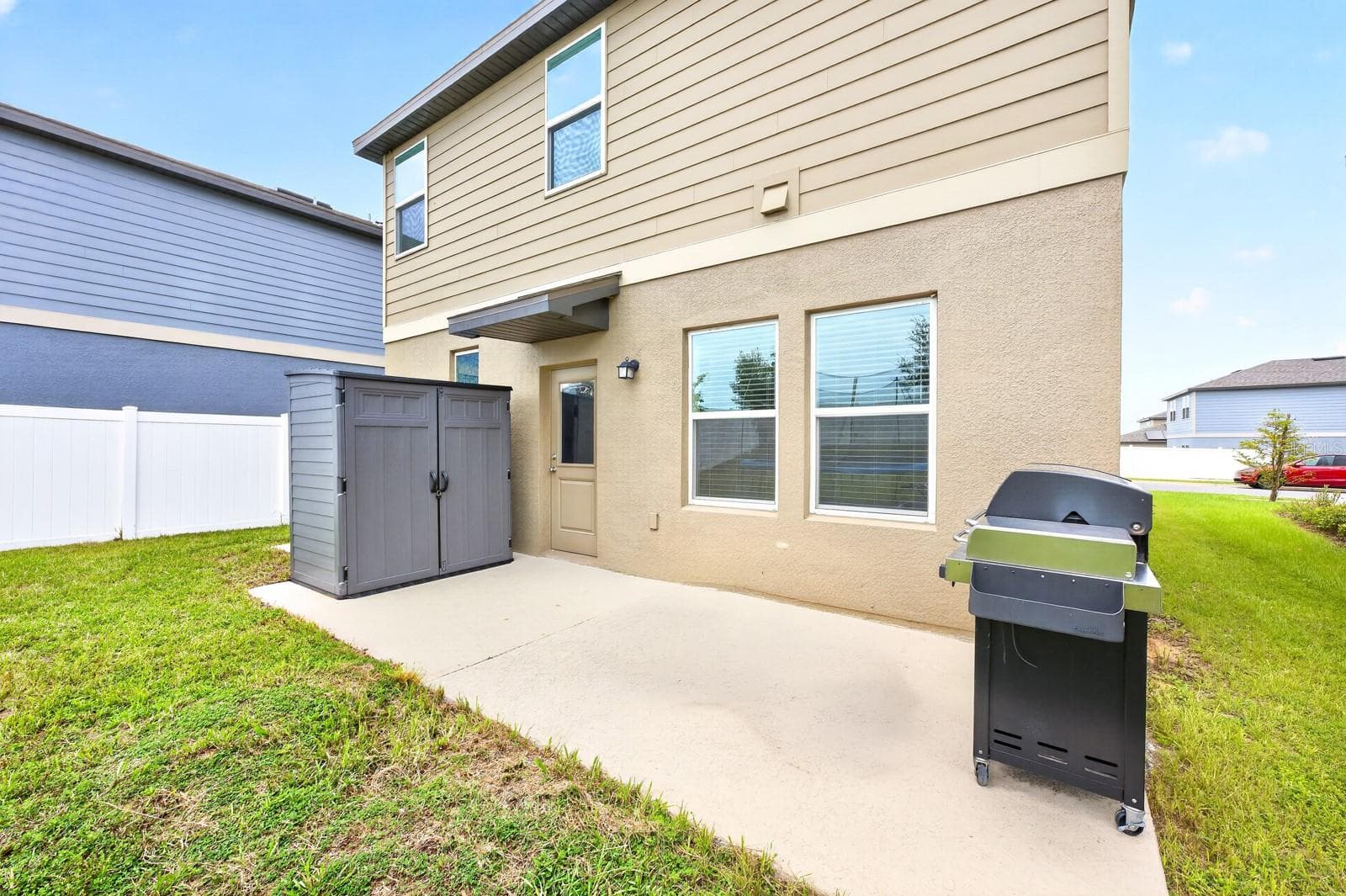 Step out to the backyard, where you'll find a patio overlooking the expansive, partially fenced yard complete with a STORAGE SHED. - 1961 HEMINGWAY CIR, GROVELAND