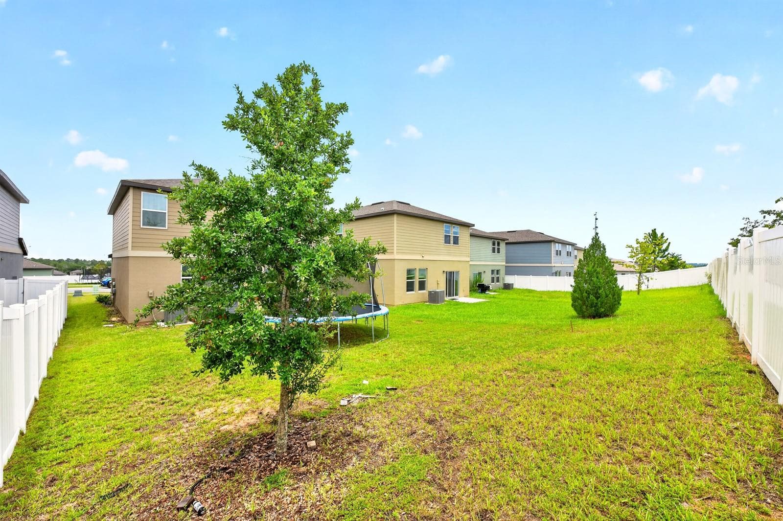 Whether you're relaxing after a long day, gardening, or enjoying the SPECTACULAR SUNSET VIEWS, this outdoor space offers endless possibilities. - 1961 HEMINGWAY CIR, GROVELAND