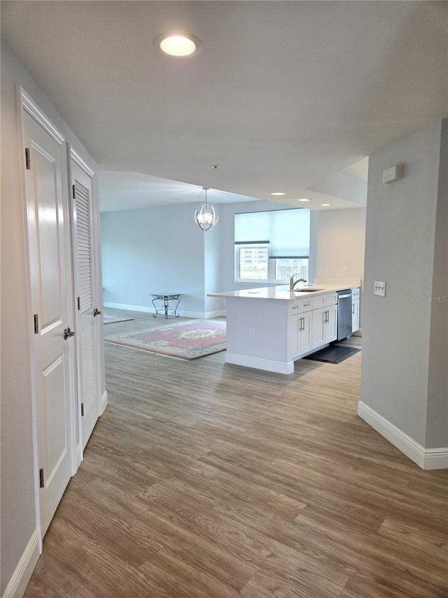 Entrance splits main living areas, the guest wing and laundry room. - 960 STARKEY RD #9206, LARGO