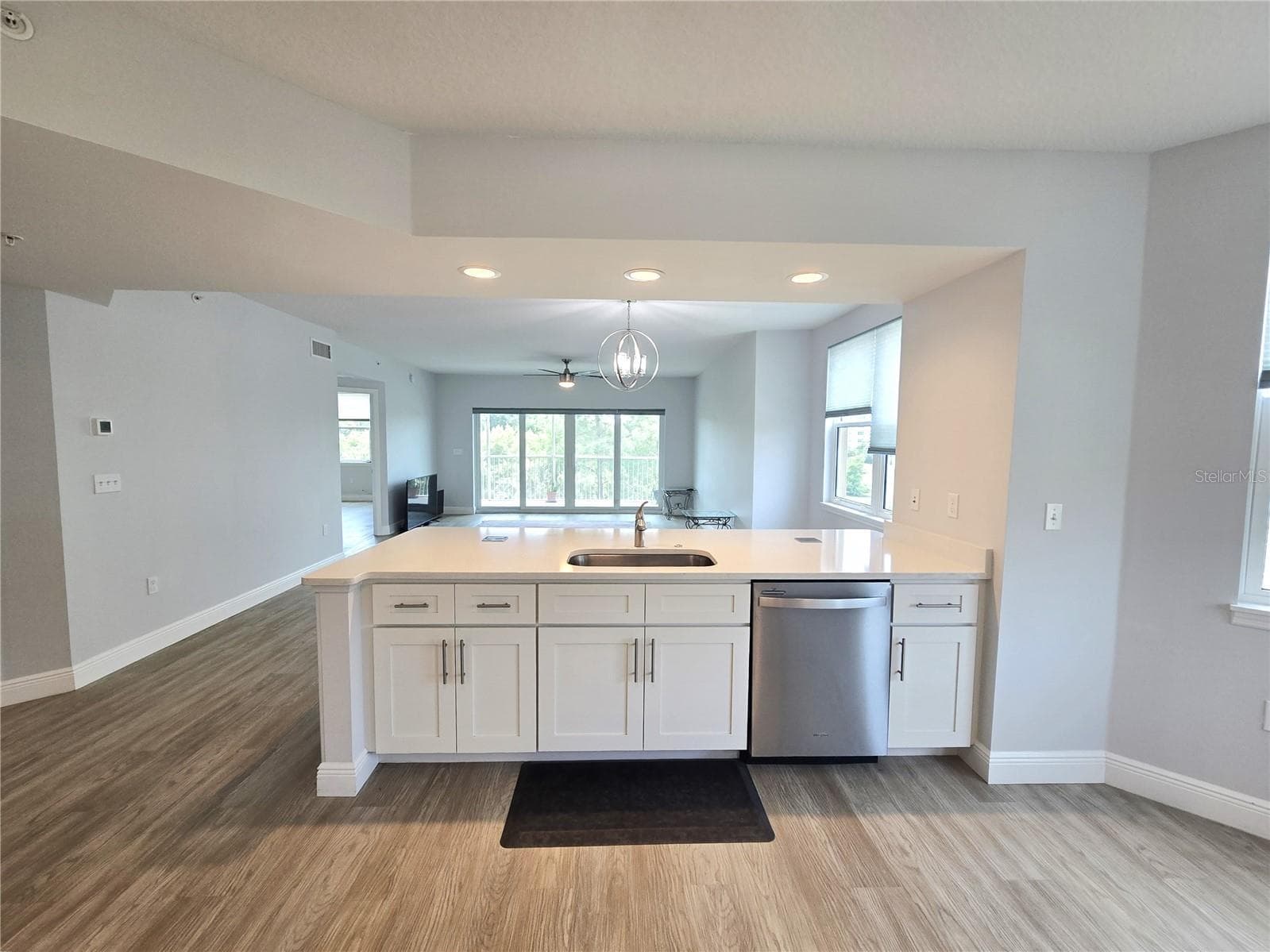A large kitchen peninsula faces fand seamlessly connects to the open living areas. - 960 STARKEY RD #9206, LARGO