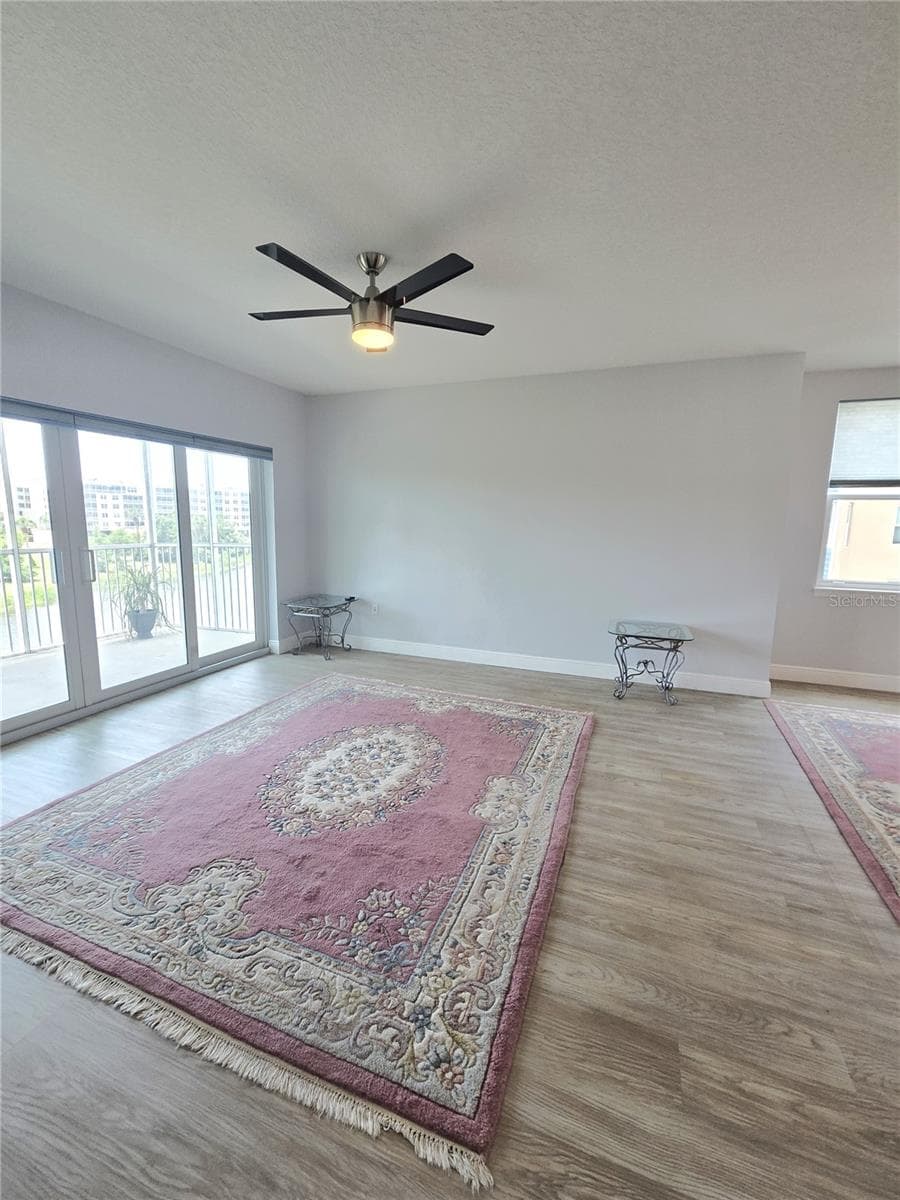 Living room with 4 glass sliding doors. - 960 STARKEY RD #9206, LARGO