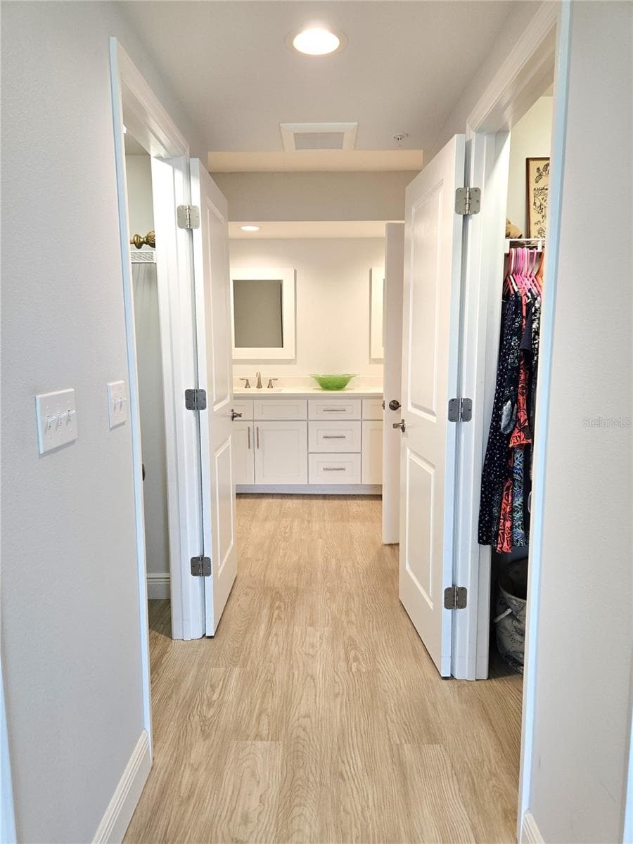 Dual closets on the left and right form a hallways to the bathroom. - 960 STARKEY RD #9206, LARGO
