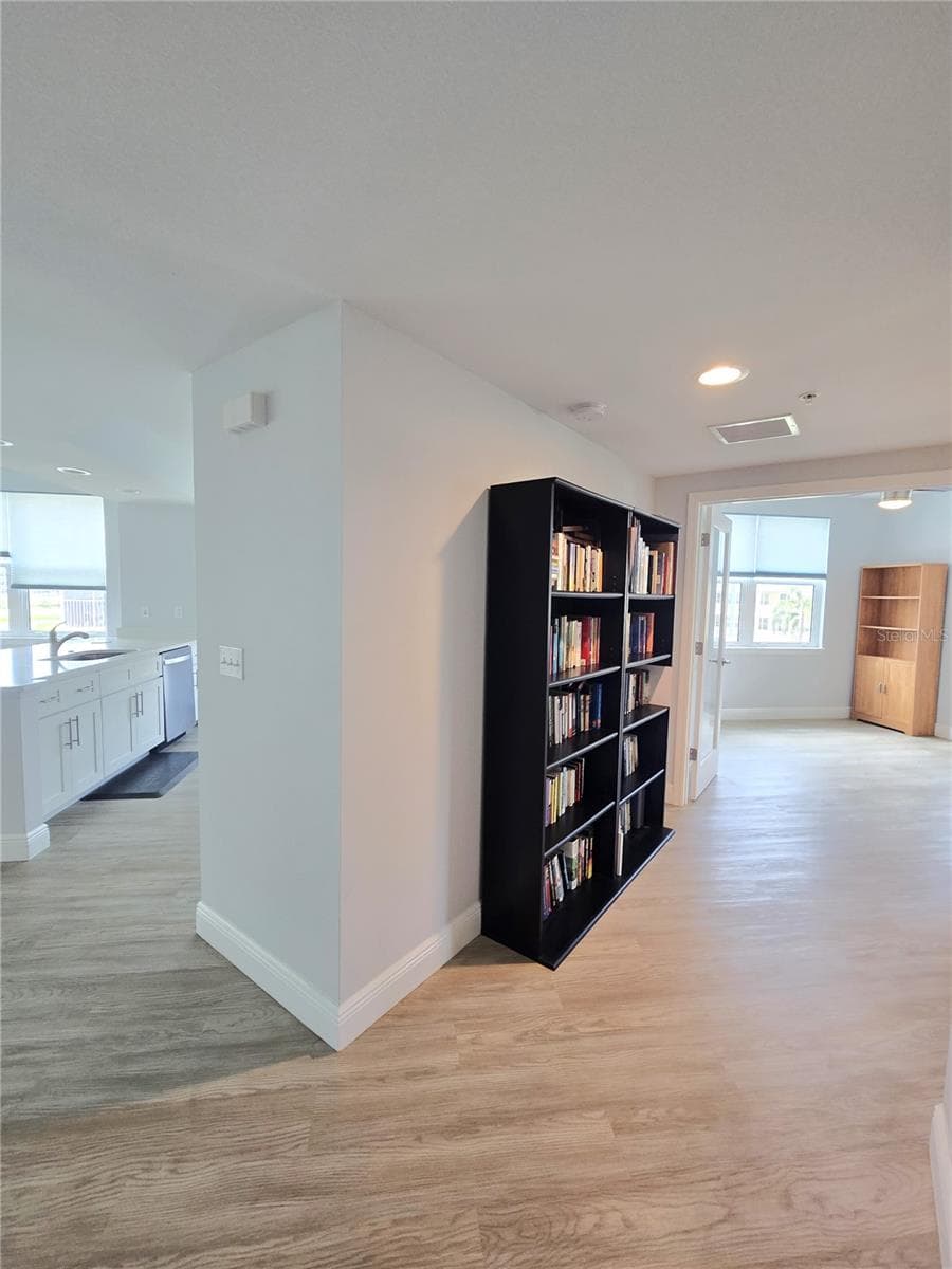 Gallery hallway leading to guest wing. - 960 STARKEY RD #9206, LARGO