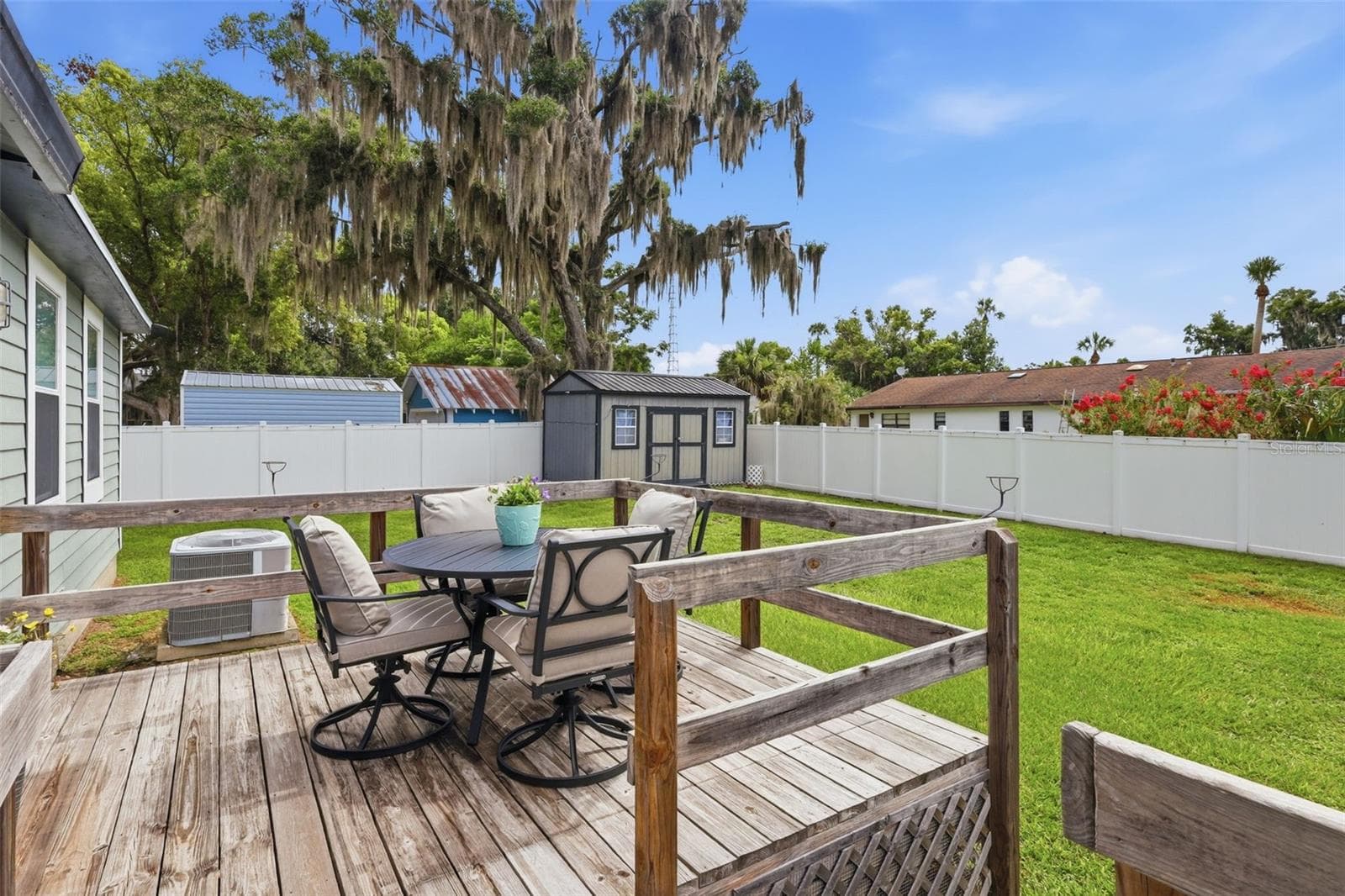 Deck overlooking fenced backyard. - 47 DAVIS AVE, UMATILLA