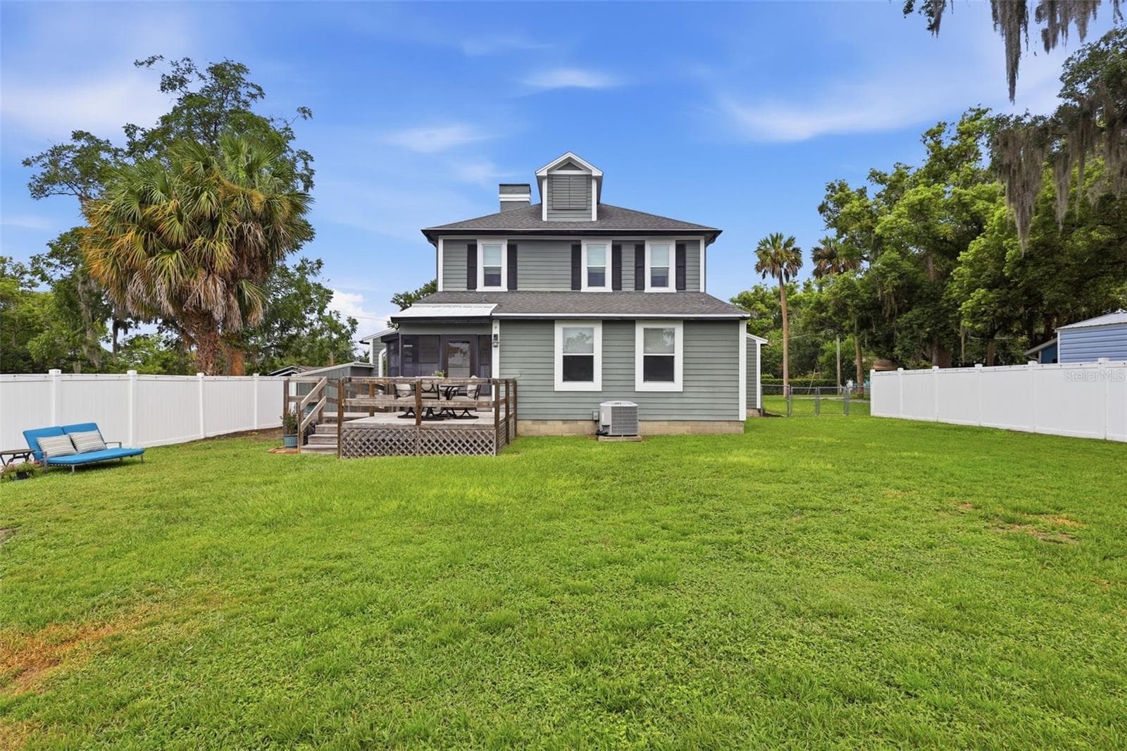 Backyard view of home. There's plenty of room to roam here! - 47 DAVIS AVE, UMATILLA