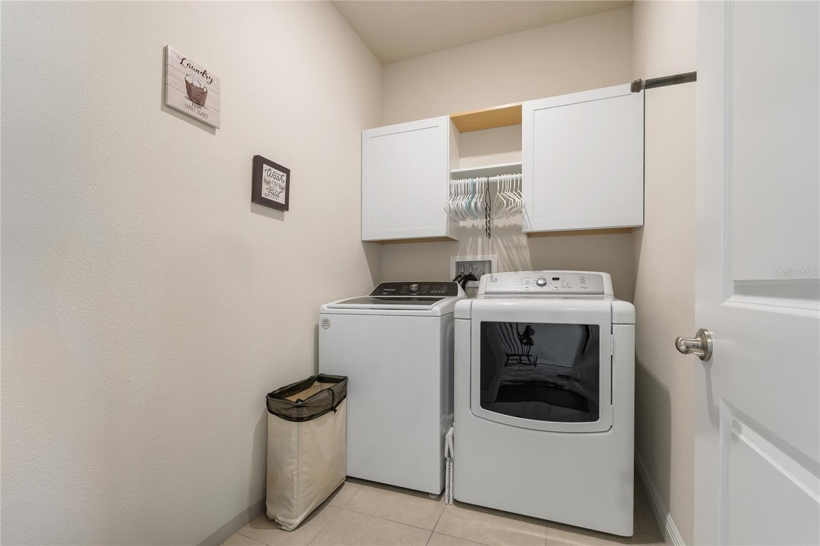 Laundry Room ~ Conveniently Upstairs! - 597 OZONA VILLAGE DR, PALM HARBOR
