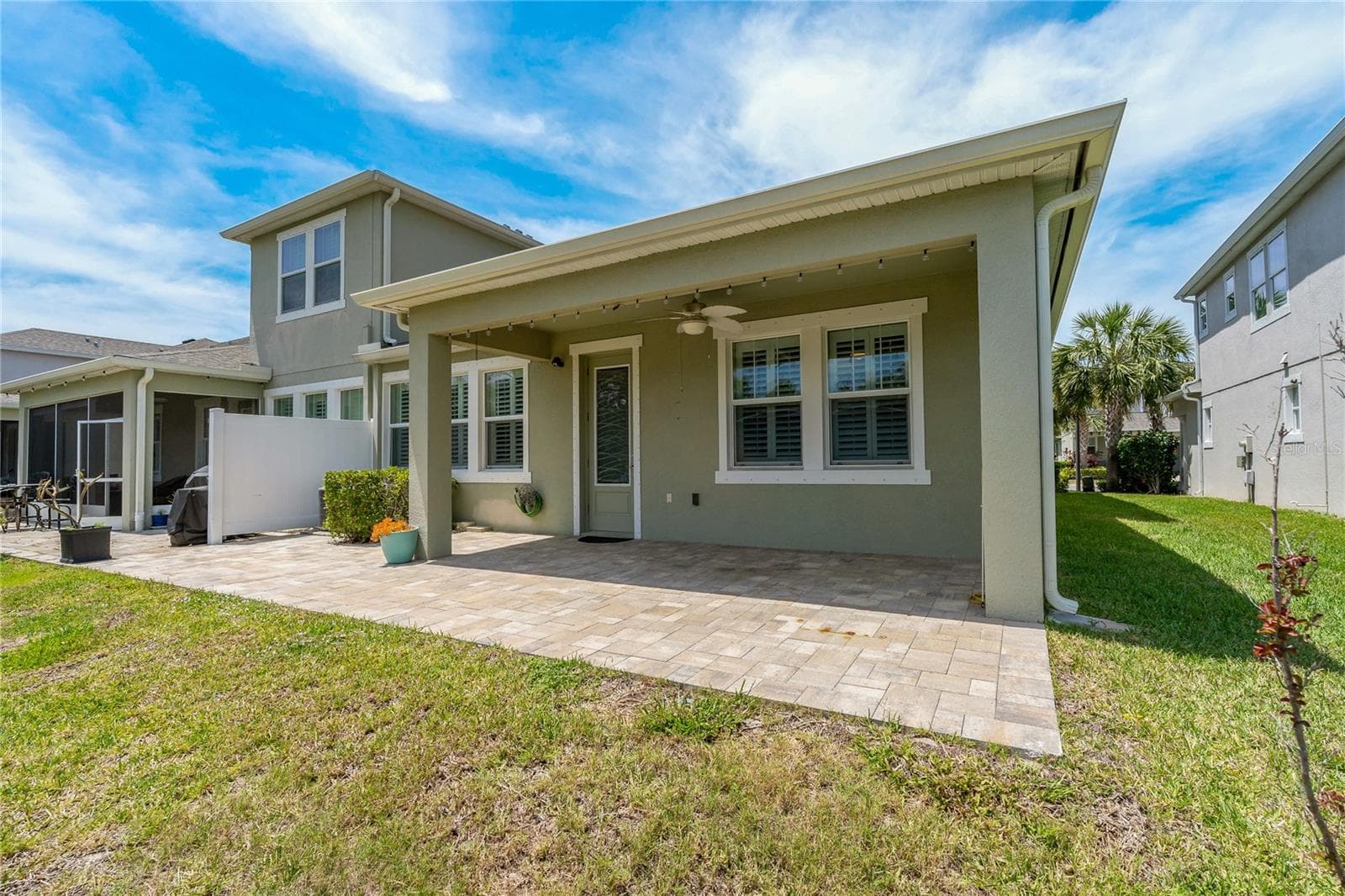 Covered Rear Lanai with a Pull Down Sun Shade! - 597 OZONA VILLAGE DR, PALM HARBOR