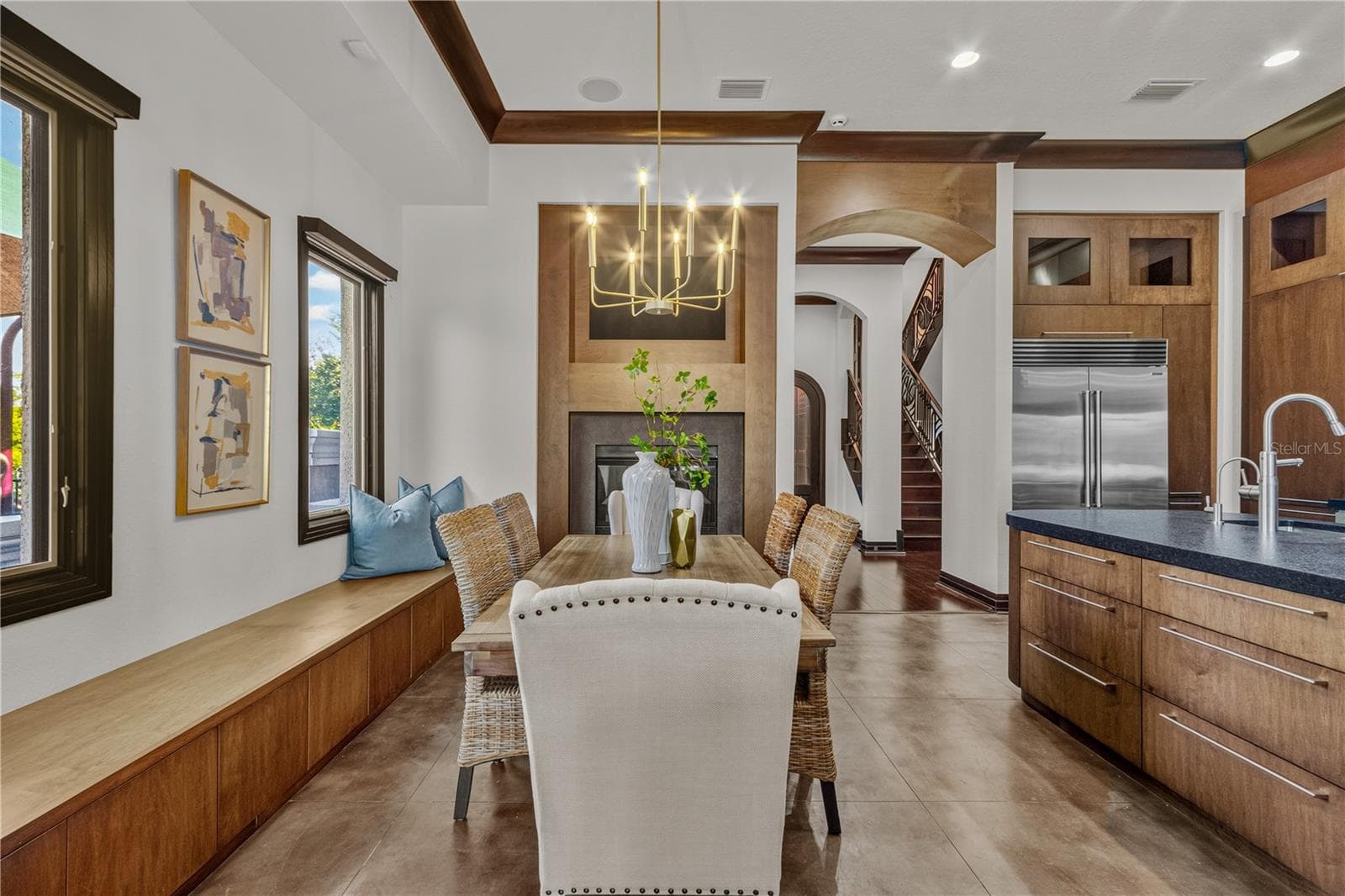 Dining area with fireplace in background. - 1008 PASEO DEL RIO NE, ST PETERSBURG