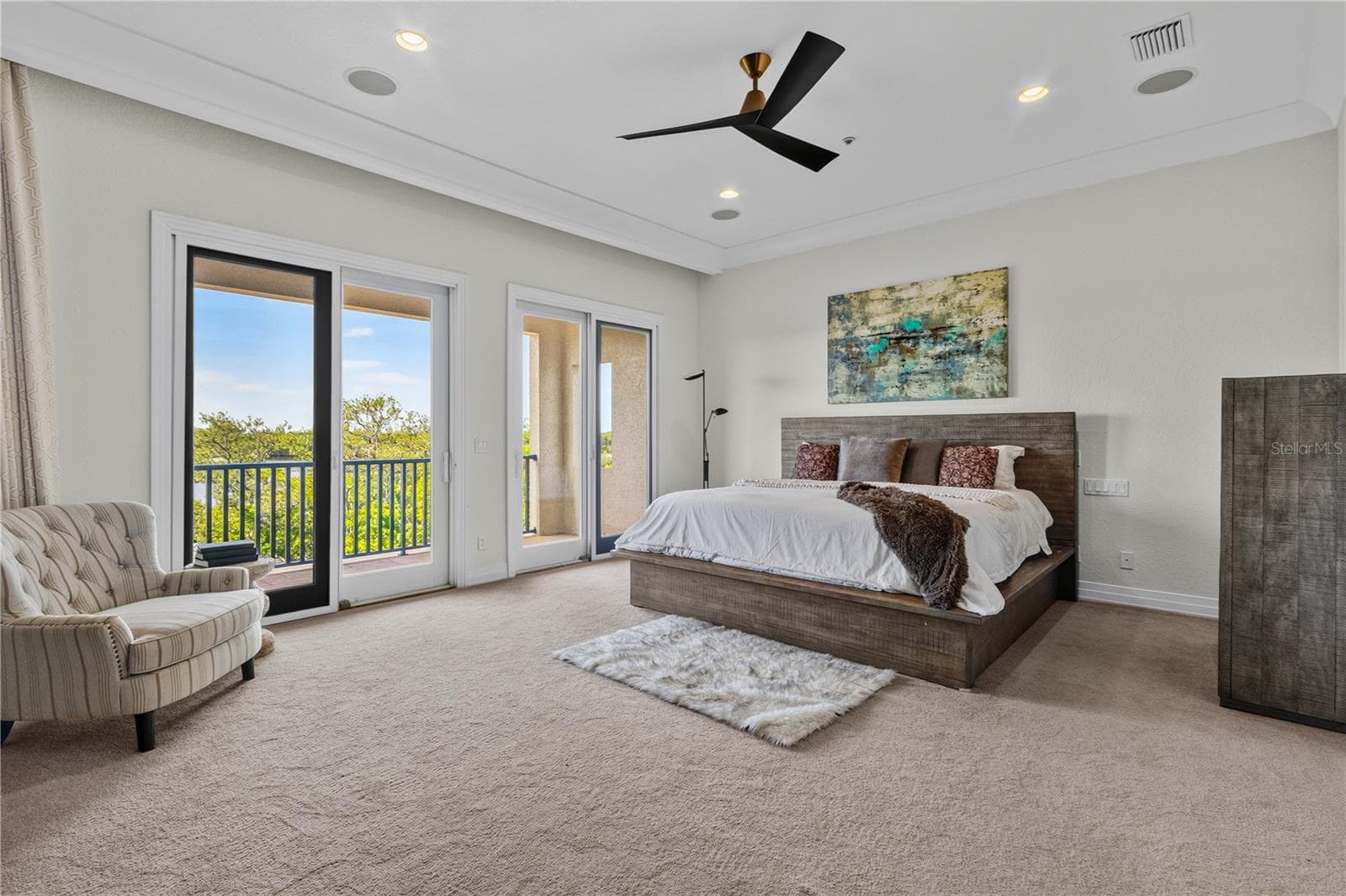 Very spacious master bedroom with expansive view of the preserve from your very own private balcony. - 1008 PASEO DEL RIO NE, ST PETERSBURG