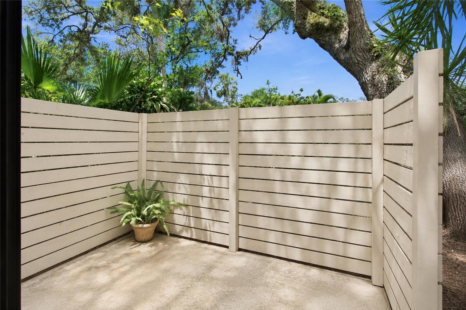 Patio off of Primary Bedroom - 6947 WOODWIND DR #77, SARASOTA