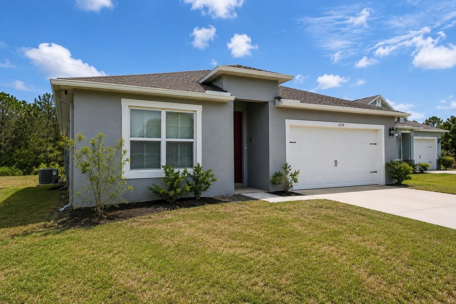 Side view front of home - 6708 ALDER RD, HARMONY