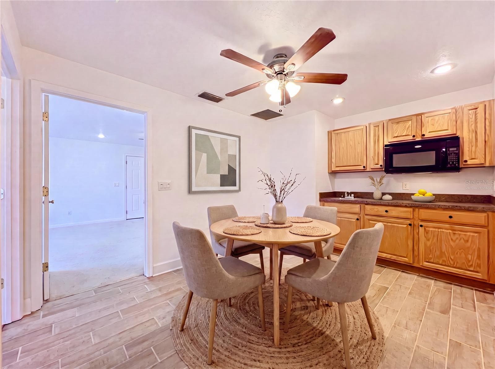 Virtually Staged Left wing Kitchenette next to Bonus Room - 2300 PINE MEADOWS PL, CHULUOTA