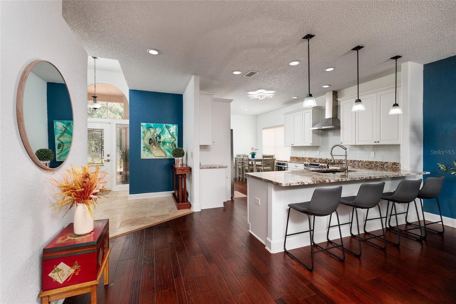Kitchen with plenty of room for sitting at the counter.  There is an eat in kitchen area to the rear of the kitchen. - 1338 DARTFORD DR, TARPON SPRINGS