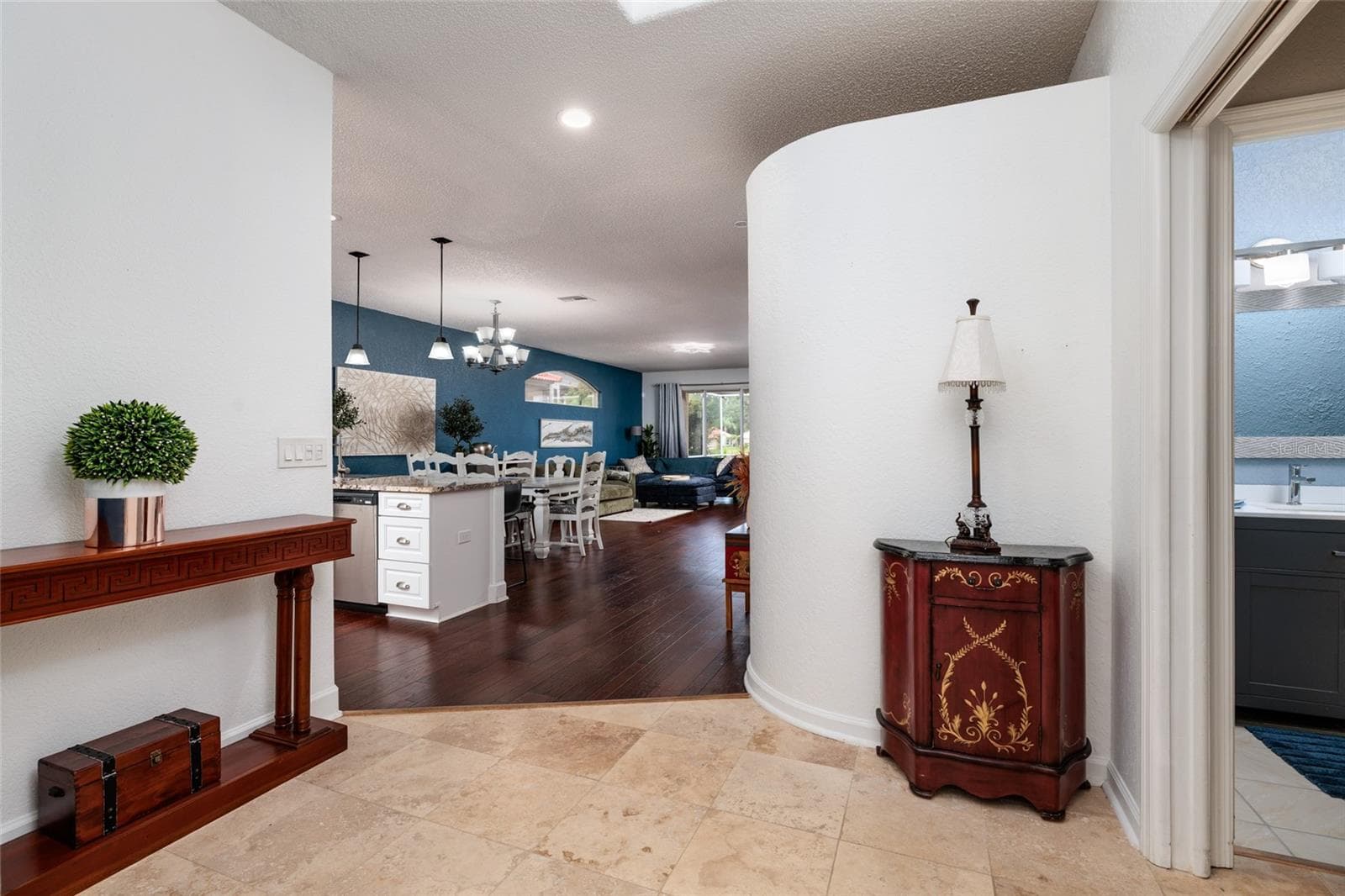 view from front door into foyer, kitchen, dinging room and living area - 1338 DARTFORD DR, TARPON SPRINGS