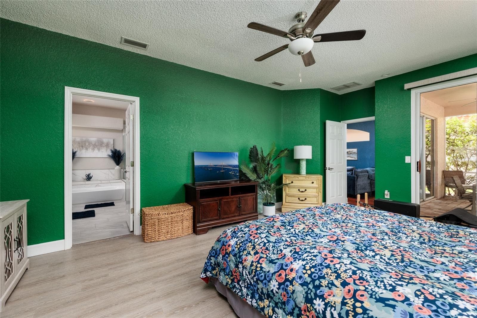 Primary bedroom leading into bathroom and walk in closet. - 1338 DARTFORD DR, TARPON SPRINGS