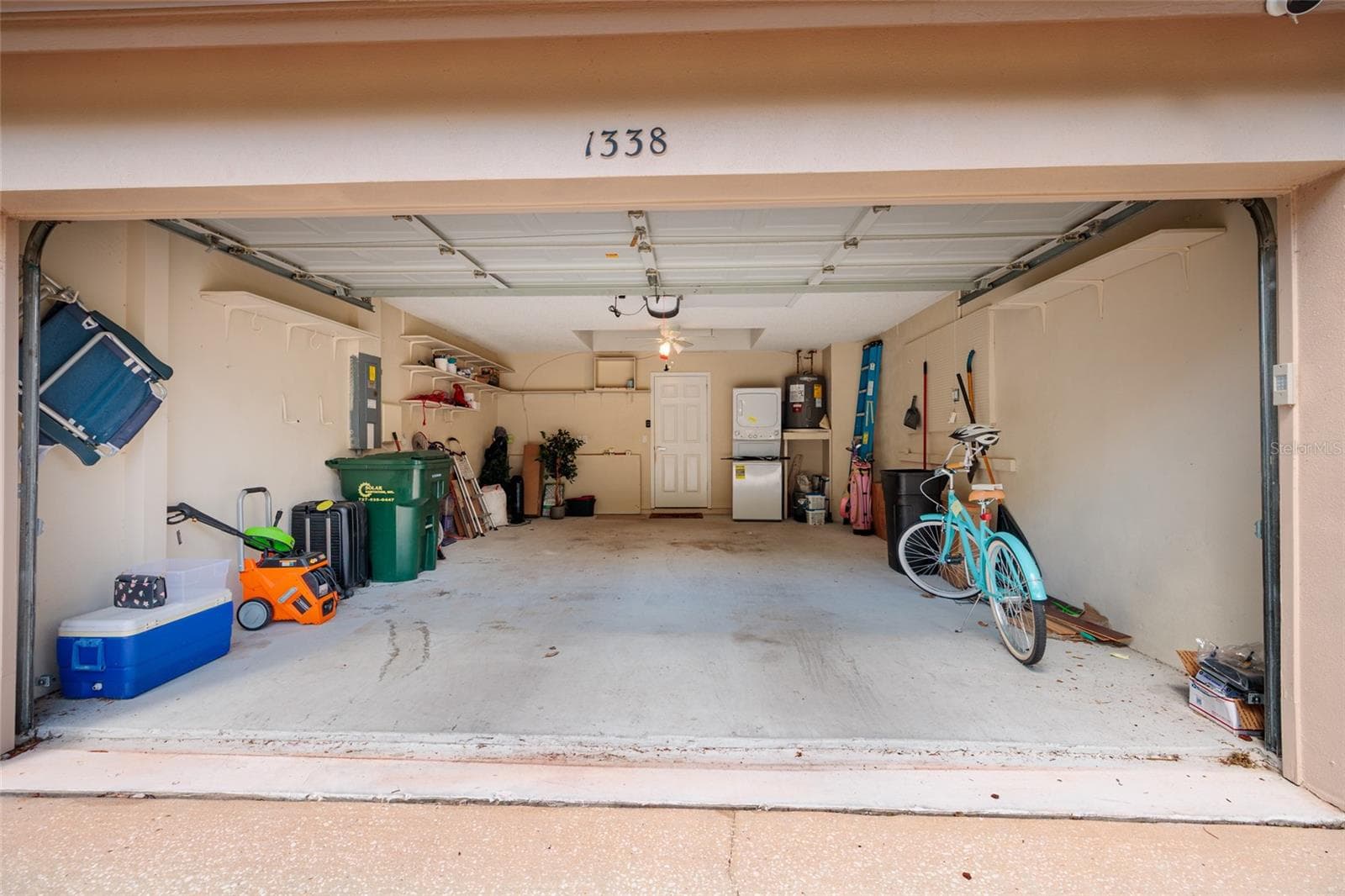 Two car garage.  Also a perfect place for your golf cart! - 1338 DARTFORD DR, TARPON SPRINGS