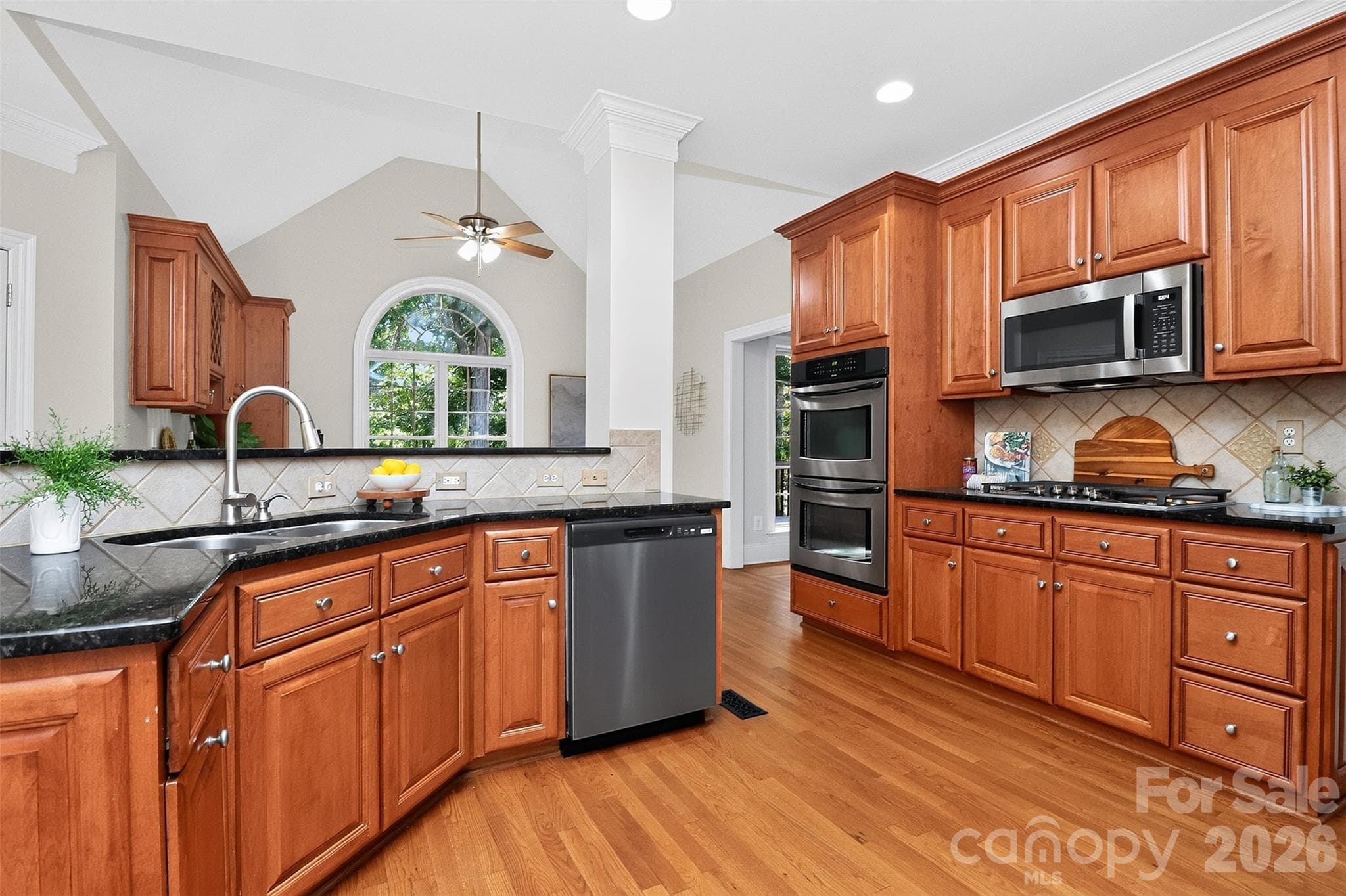 Kitchen with new dishwasher, microwave and gas cooktop. - 4817 Pimlico Lane, Waxhaw