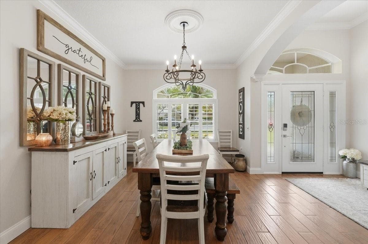 Formal Dining room w/ planation shutters - 3158 BEAUCHAMP CT, WINTER HAVEN