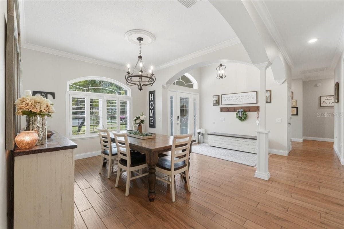 Formal Dining room w/ arched entrances - 3158 BEAUCHAMP CT, WINTER HAVEN