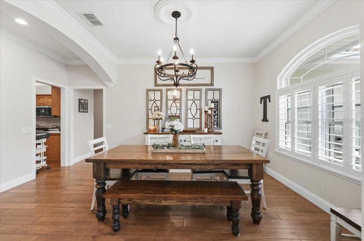 formal dining room w/ easy accesss to kitchen - 3158 BEAUCHAMP CT, WINTER HAVEN
