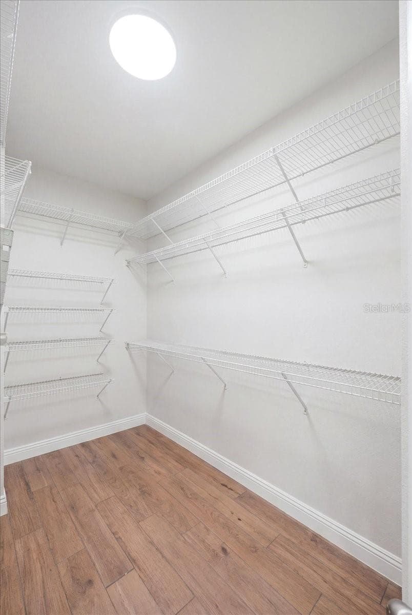 primary suite walk-in closet - 3158 BEAUCHAMP CT, WINTER HAVEN