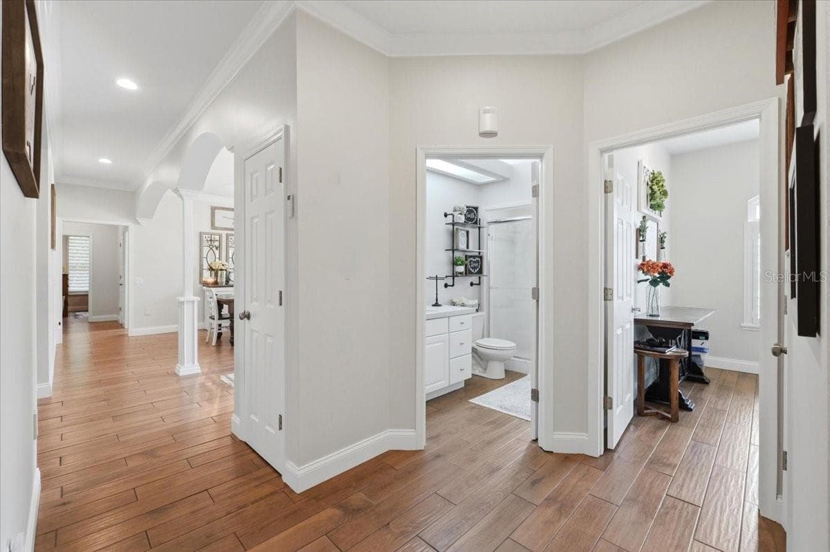 hallway leading to 4th BR & hall bathroom - 3158 BEAUCHAMP CT, WINTER HAVEN
