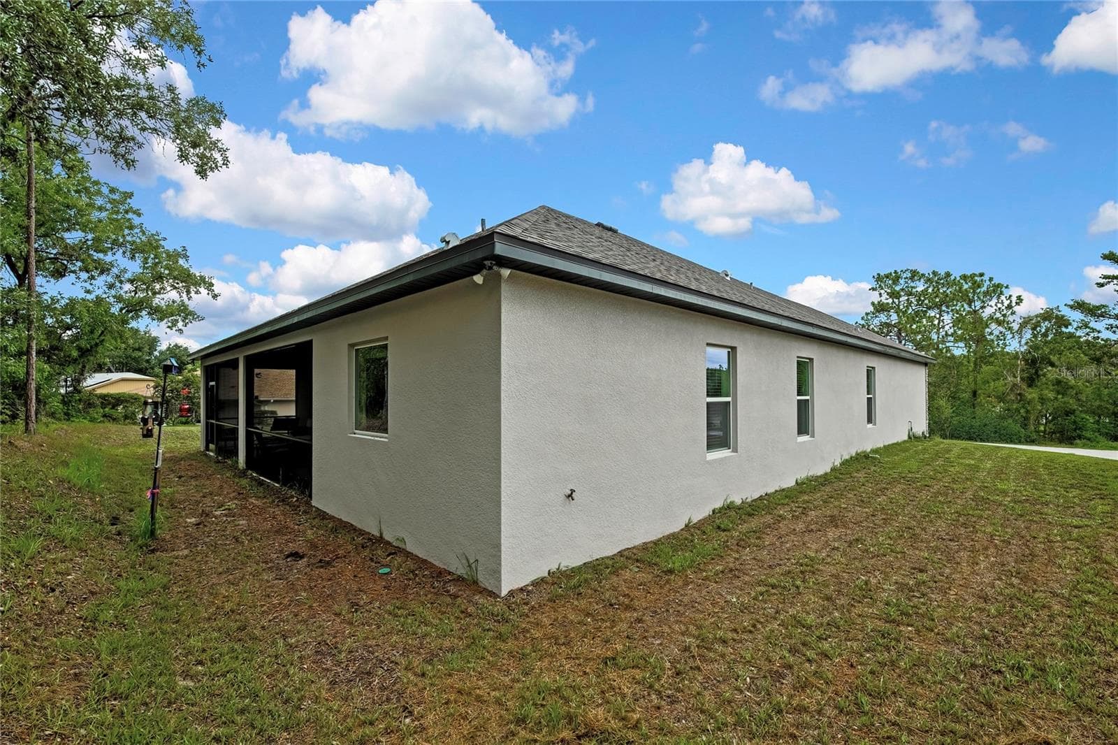 other side of exterior - 32 CARNATION CT, HOMOSASSA