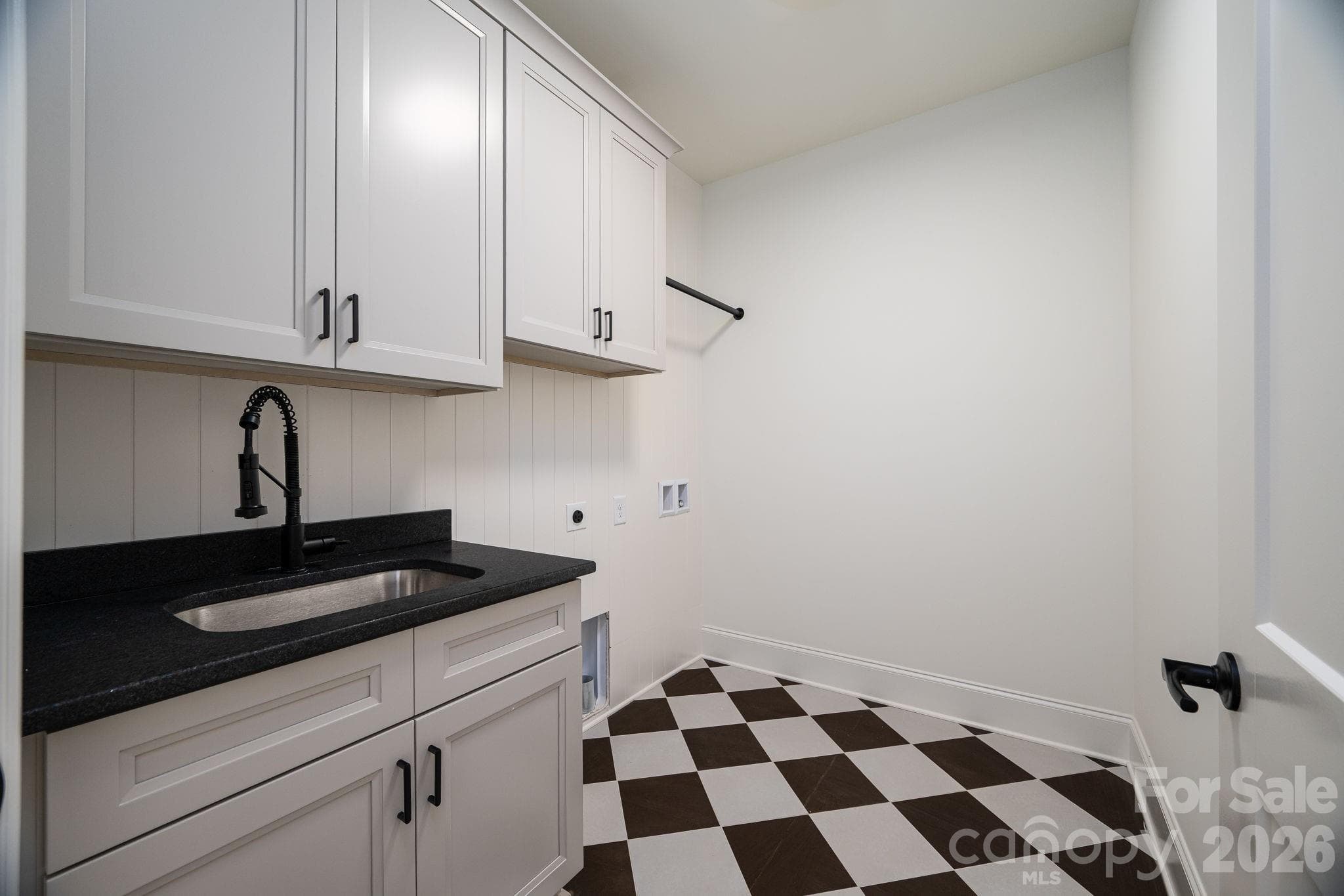 Large Laundry room with beautiful checkered board tile - 526 N Aspen Street, Lincolnton