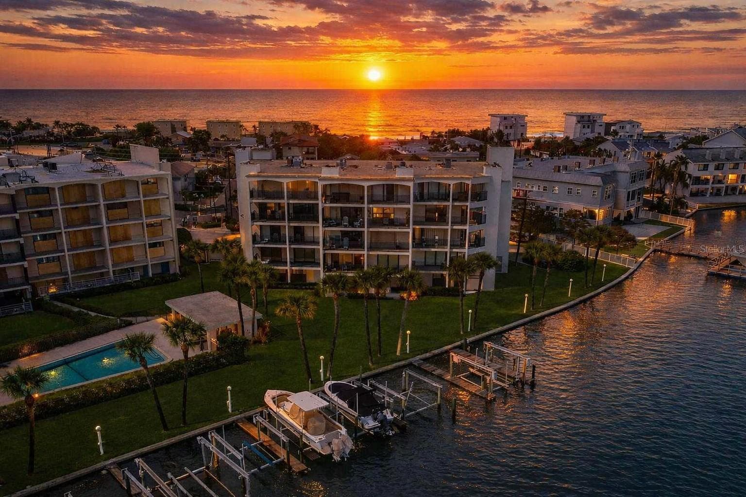 BEST LOCATION ON TREASURE ISLAND! Enjoy breathtaking waterfront views, coastal charm, and easy access to the beach, restaurants, and entertainment - 9825 HARRELL AVE #404, TREASURE ISLAND